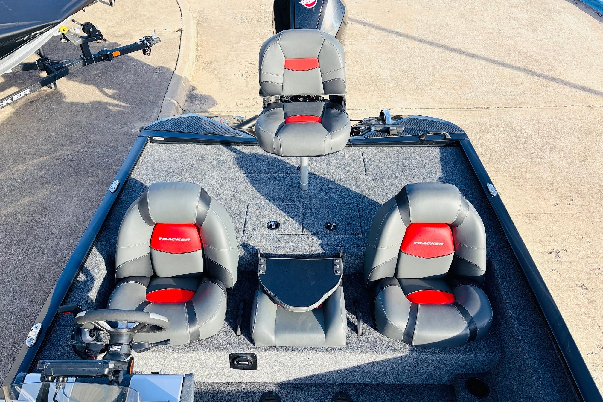 2025 Tracker Savage 215 boat interior with three gray and red seats.
