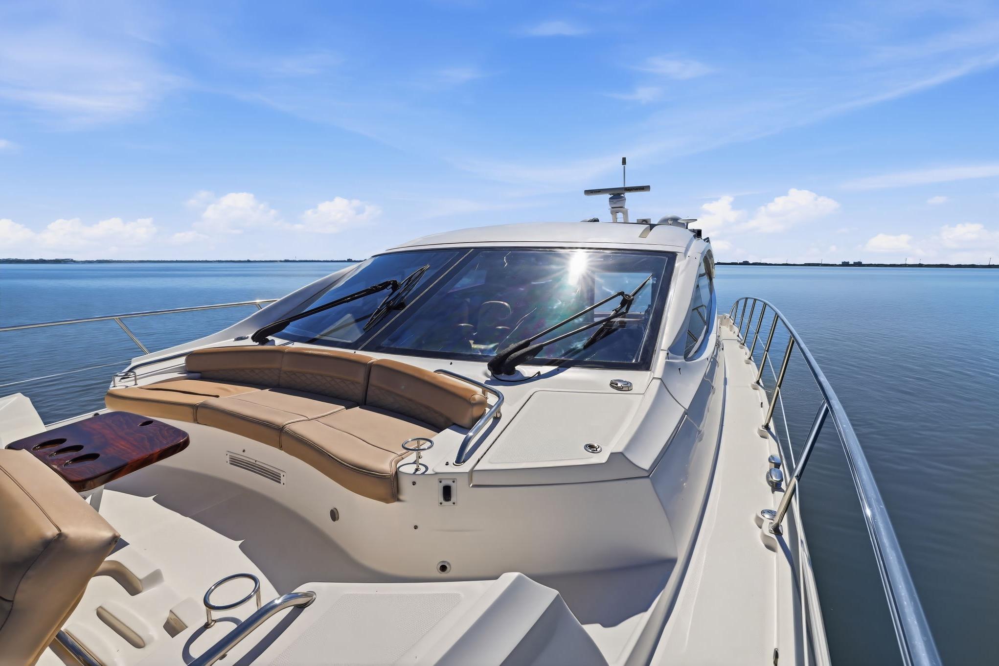 2017 Sea Ray L590 yacht on calm water, featuring sleek design and luxurious seating.