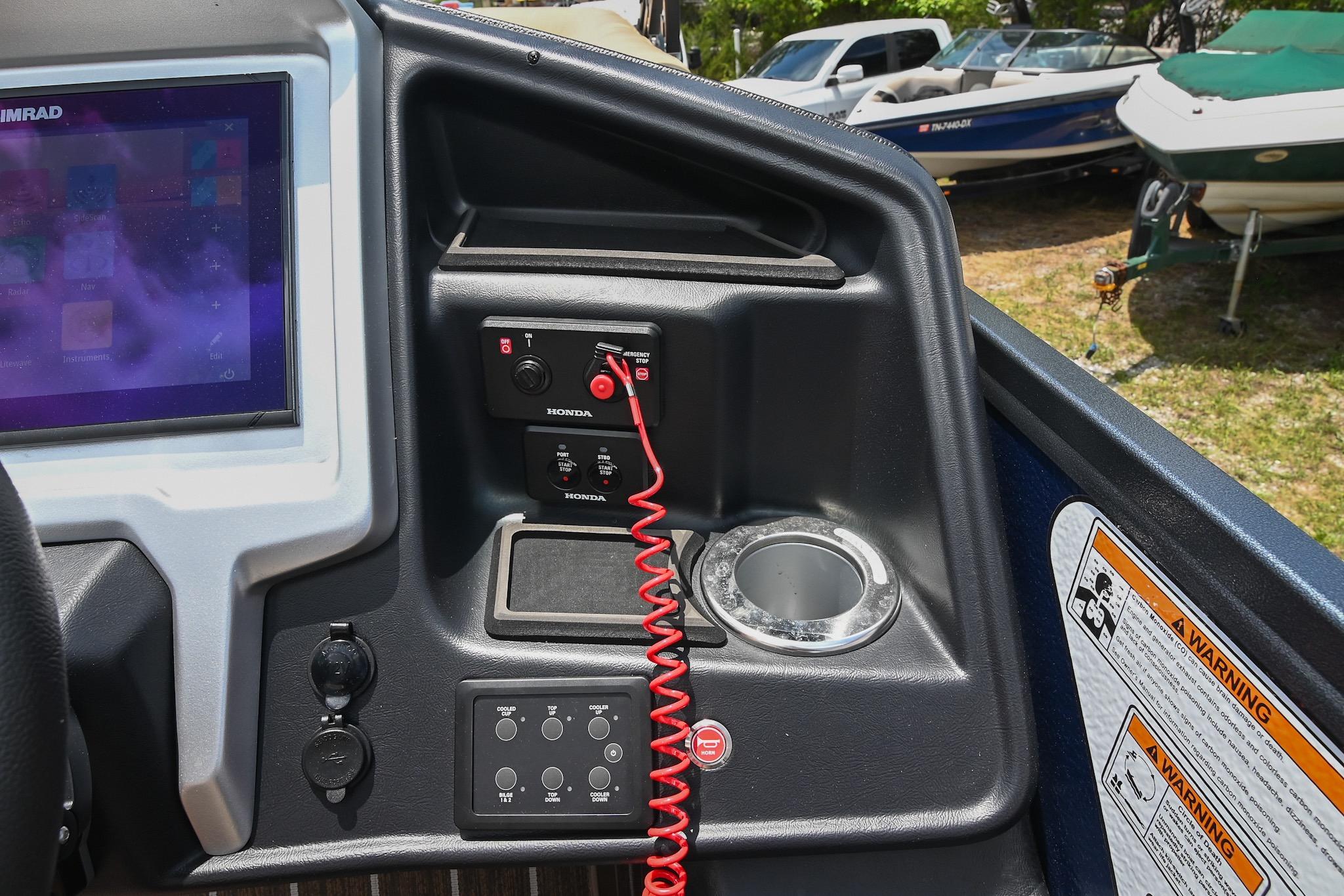 Dashboard of 2023 Premier 270 Intrigue RF boat with control panel and display screen.