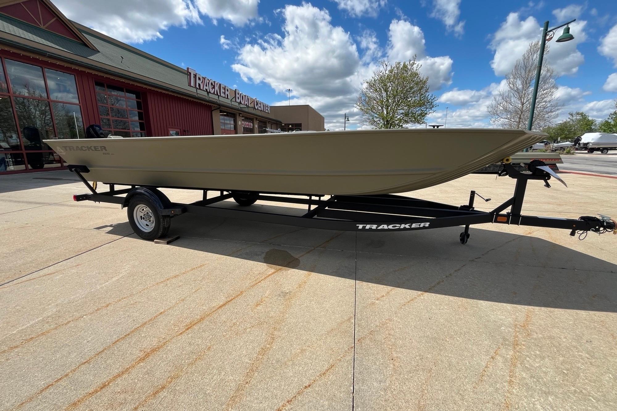 2026 Tracker Grizzly 2072 Utility boat on trailer outside Tracker Boat Center.