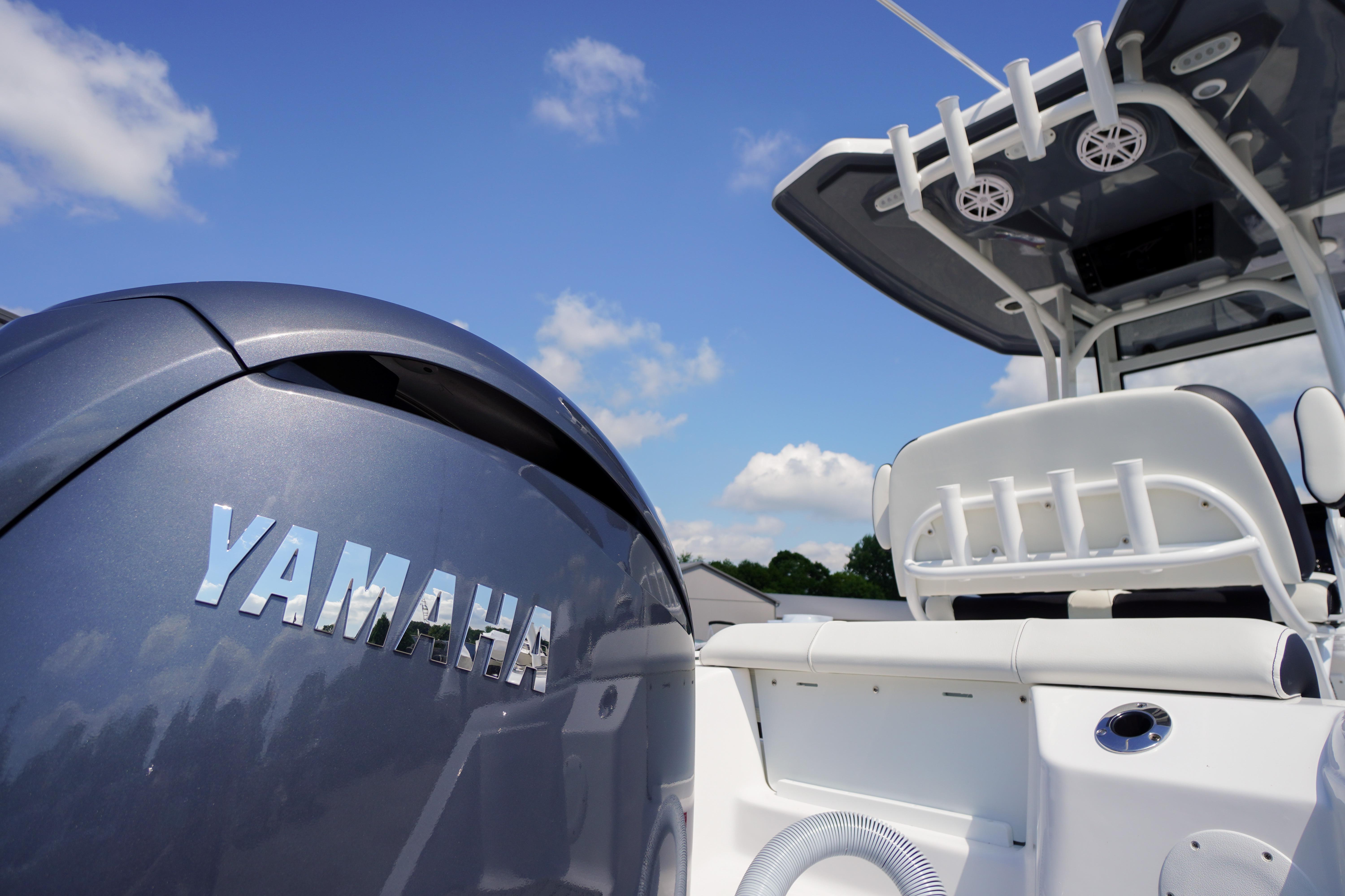 2026 Tidewater 220 CC Adventure boat with Yamaha engine under clear blue sky.
