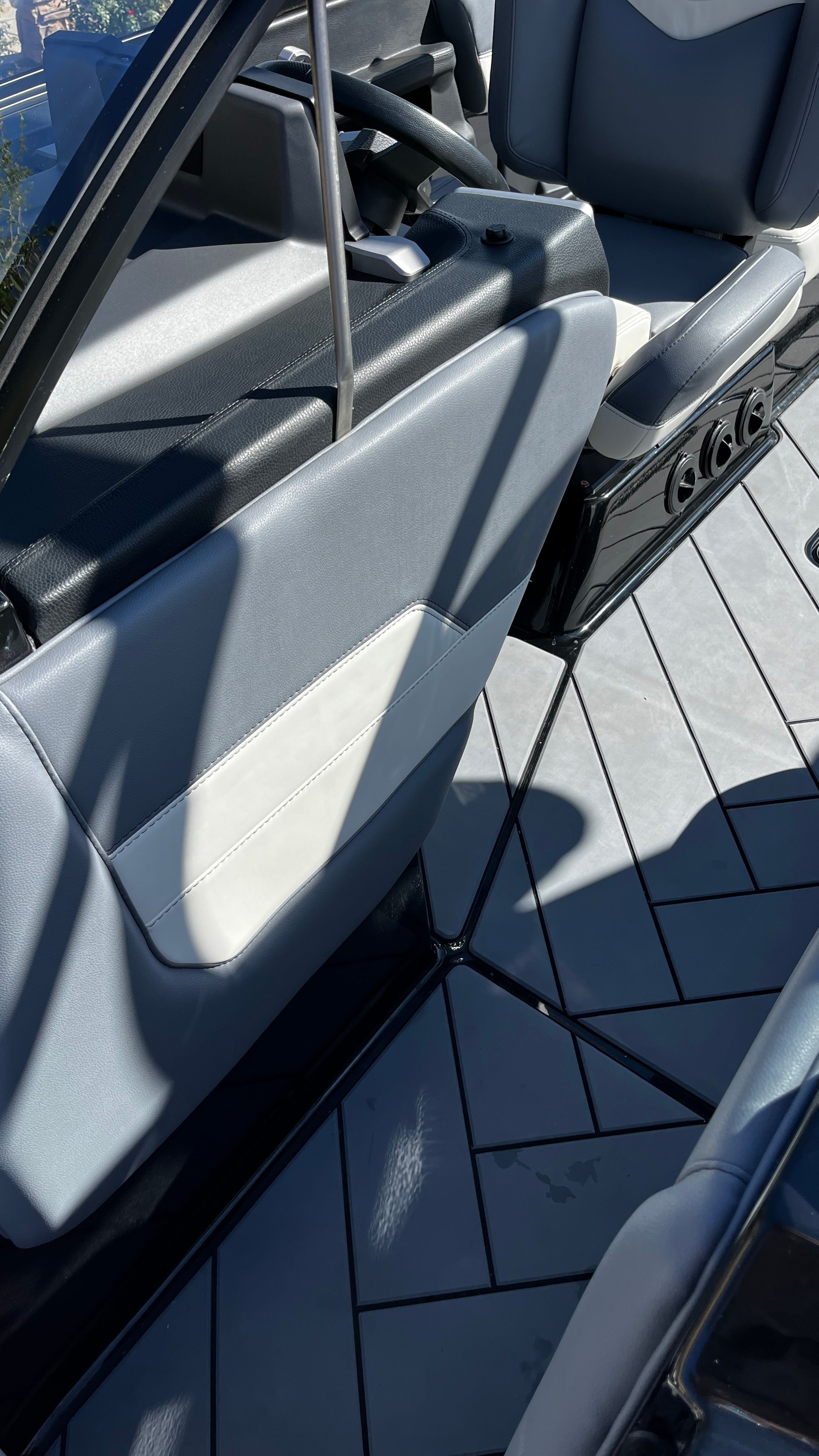 Close-up of a Malibu Wakesetter 26 LSV interior with gray upholstery.