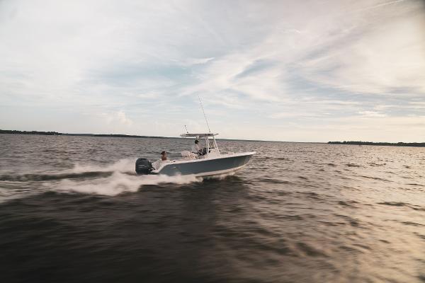 2024 Sea Hunt Ultra 234 speeding on open water.