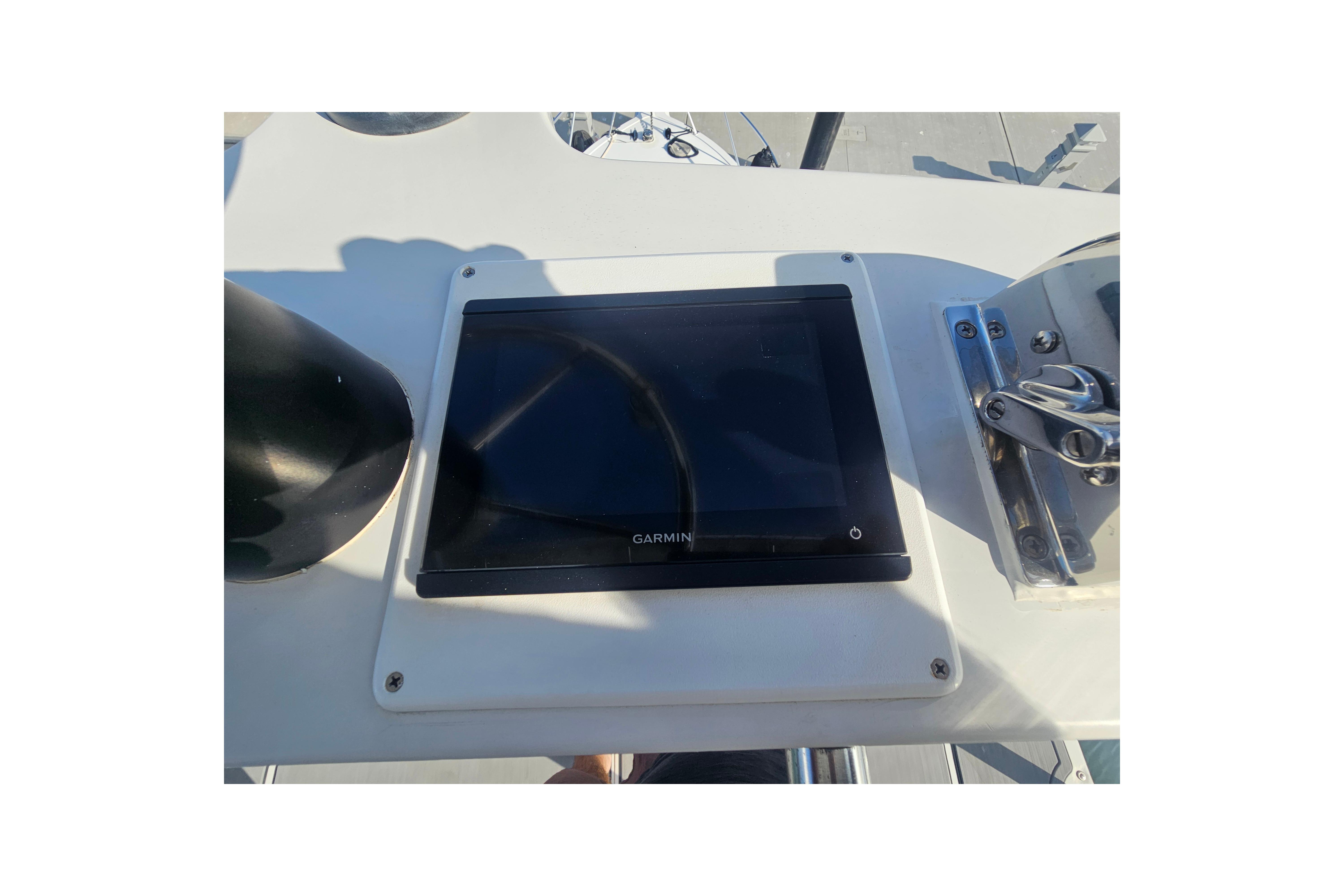 Garmin navigation display on 2003 Topaz 32 Express boat dashboard.