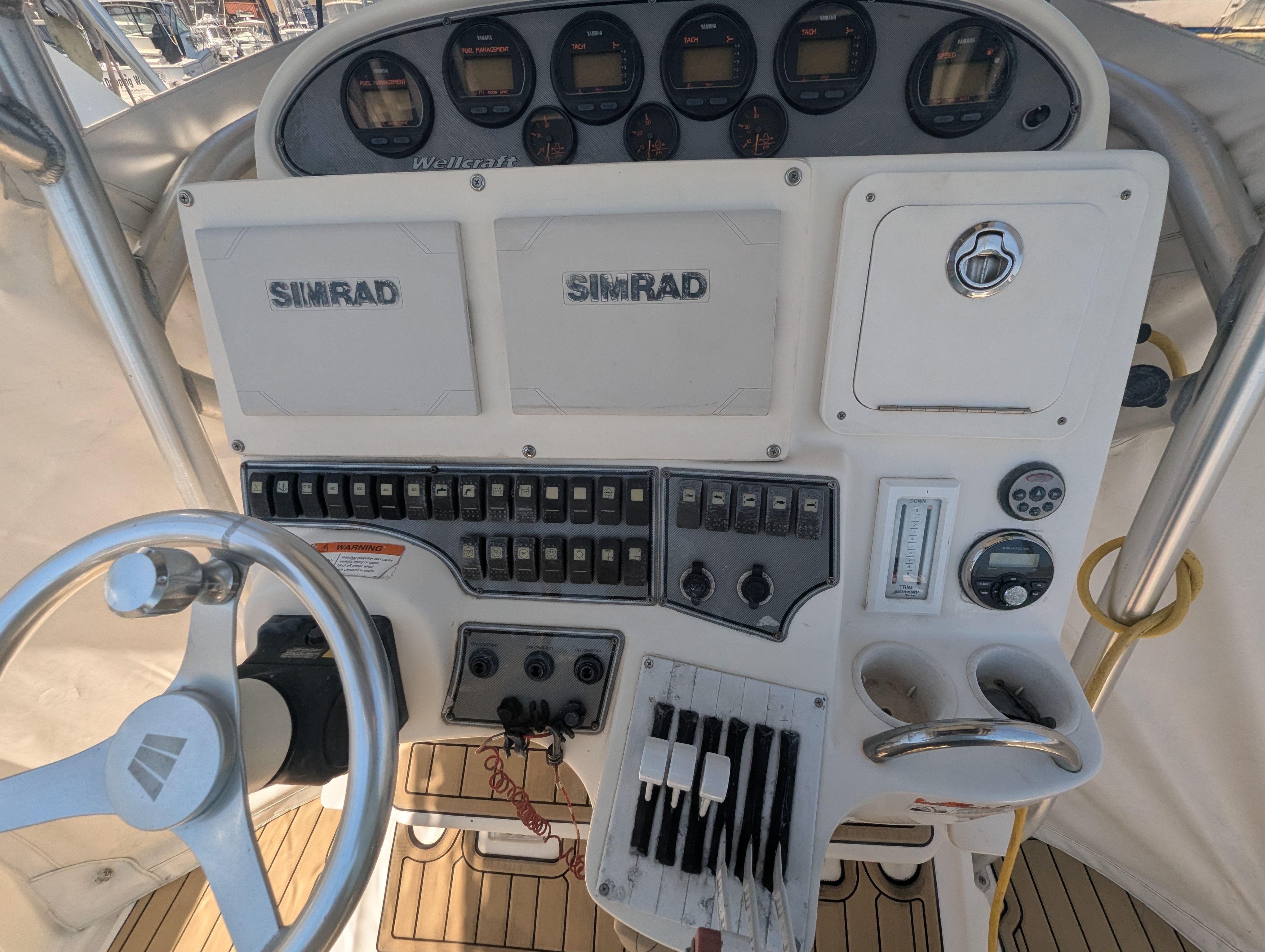 2005 Wellcraft 35 CCF helm with Simrad electronics and controls.