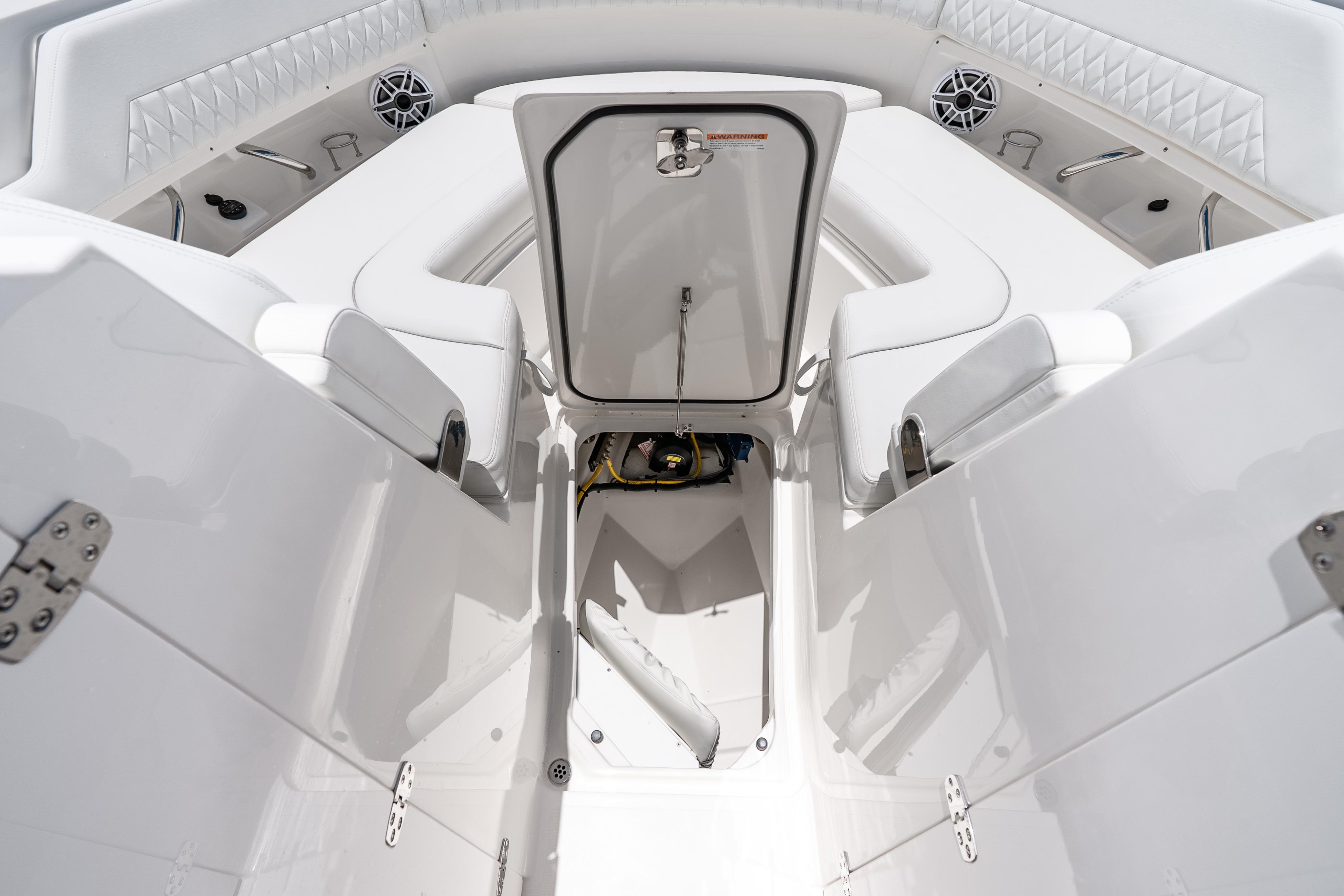 2026 Pursuit DC 326 Dual Console boat interior with open storage compartment.