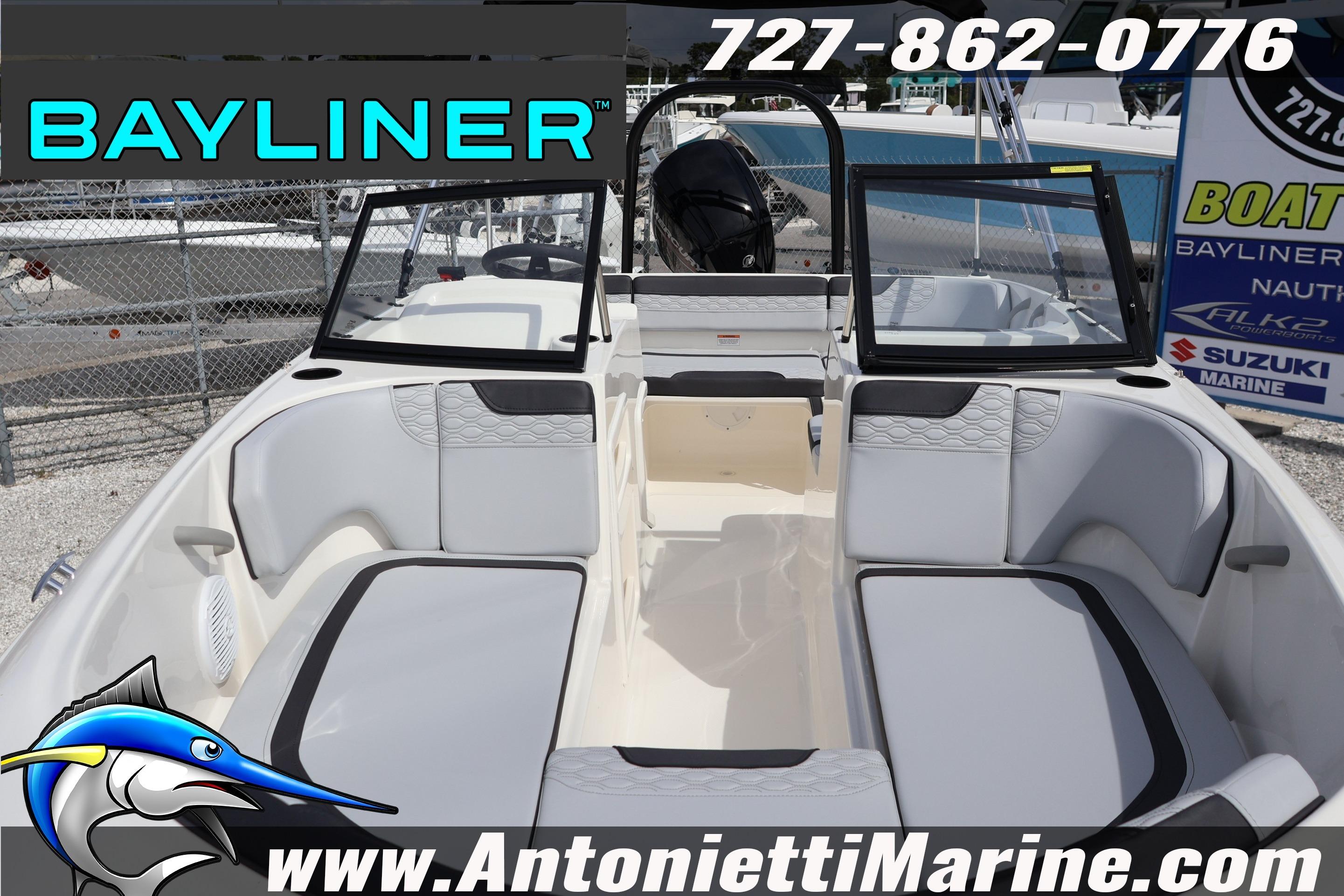 2026 Bayliner Element M17 boat interior with seating, windshield, and marine branding.