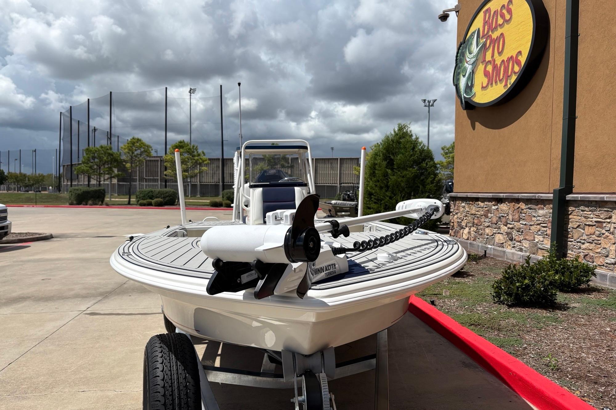 2026 Mako 18 Pro Skiff Patriot Edition boat at Bass Pro Shops parking lot.