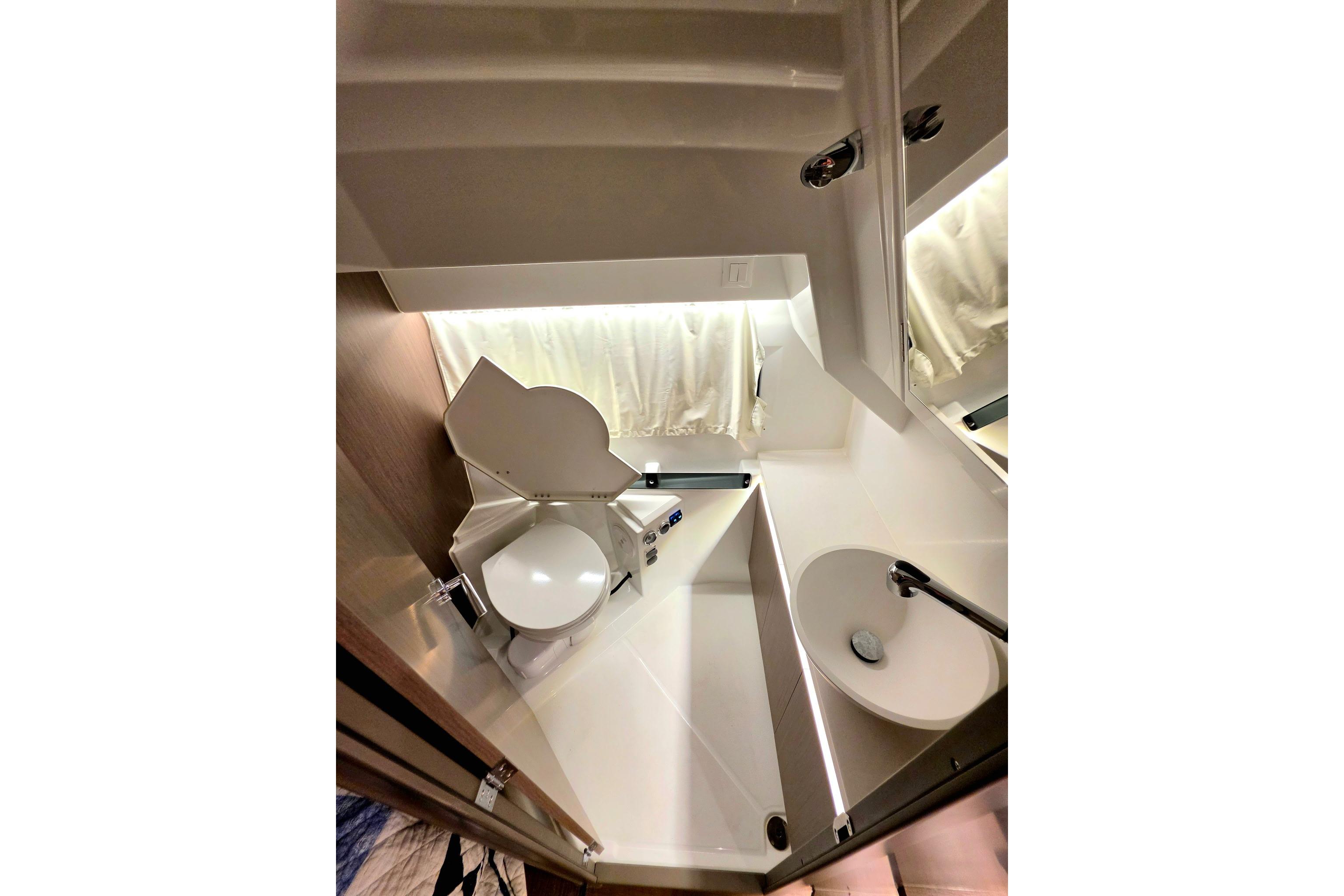 Modern bathroom interior of 2026 Jeanneau NC 895 Series 2 boat, featuring sleek design and fixtures.