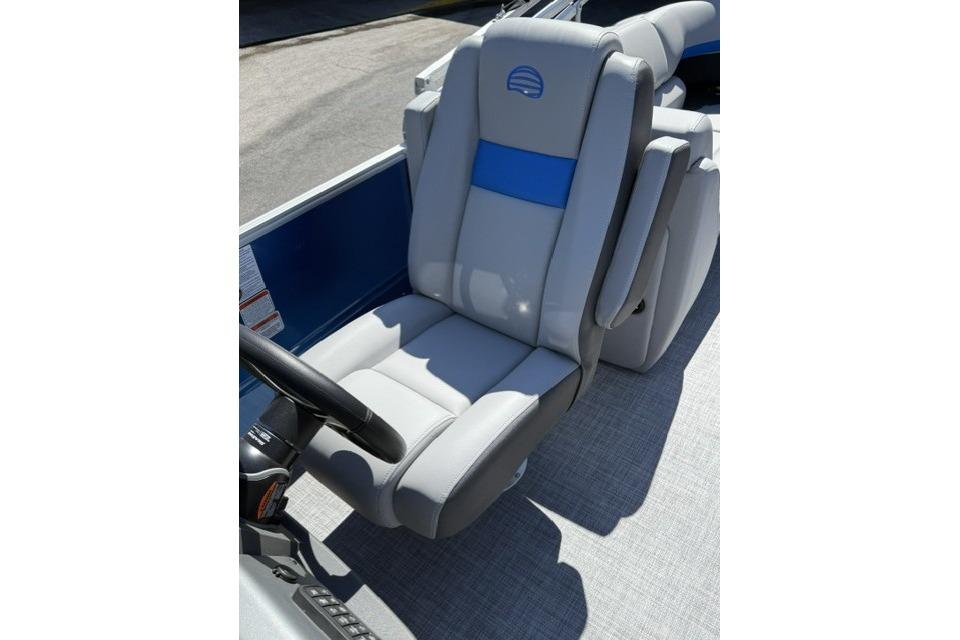 Captain's chair on 2026 Sun Tracker Party Barge 24 XP3, featuring gray and blue upholstery.
