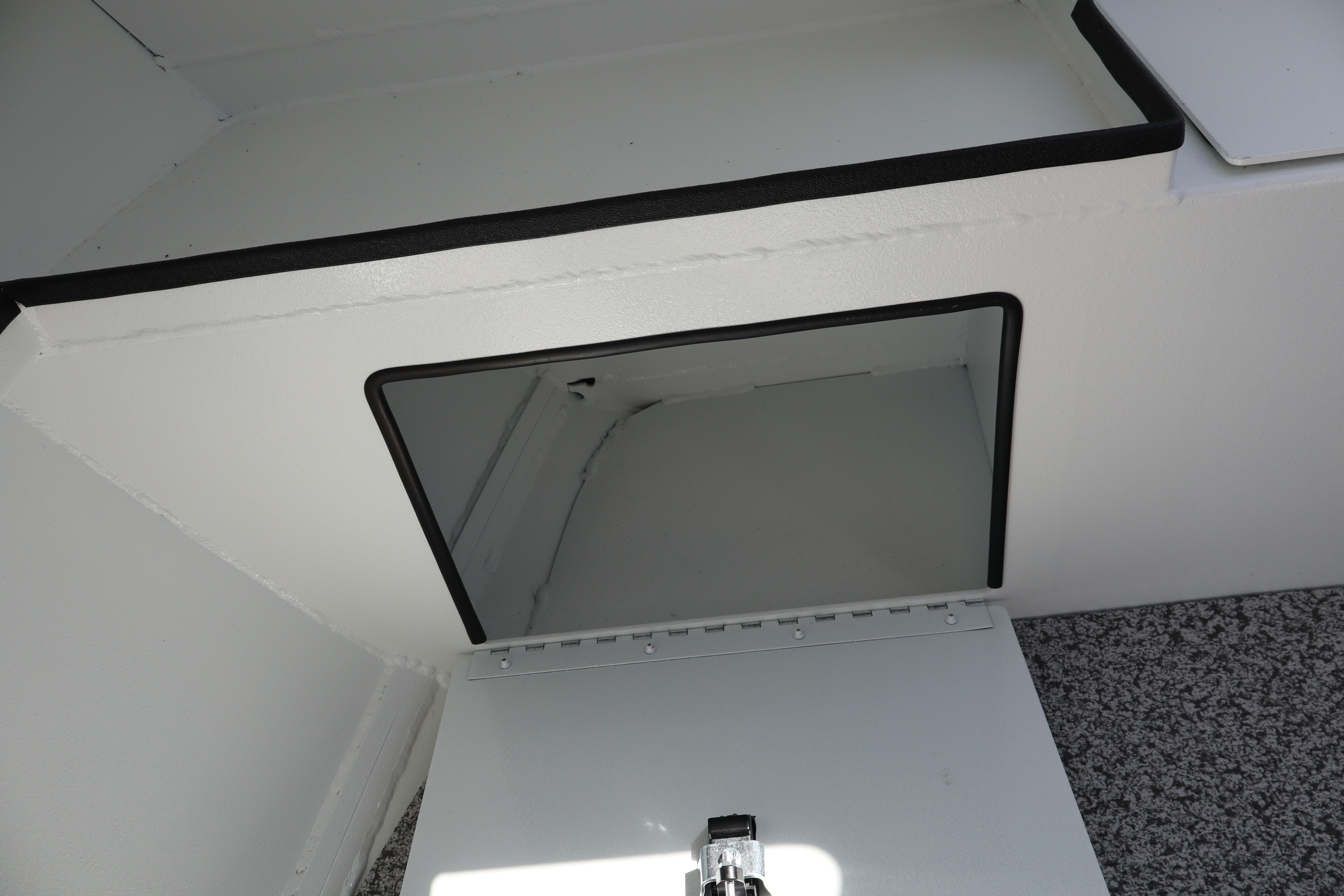 2026 Alumaweld Stryker 202 boat storage compartment with open hatch.