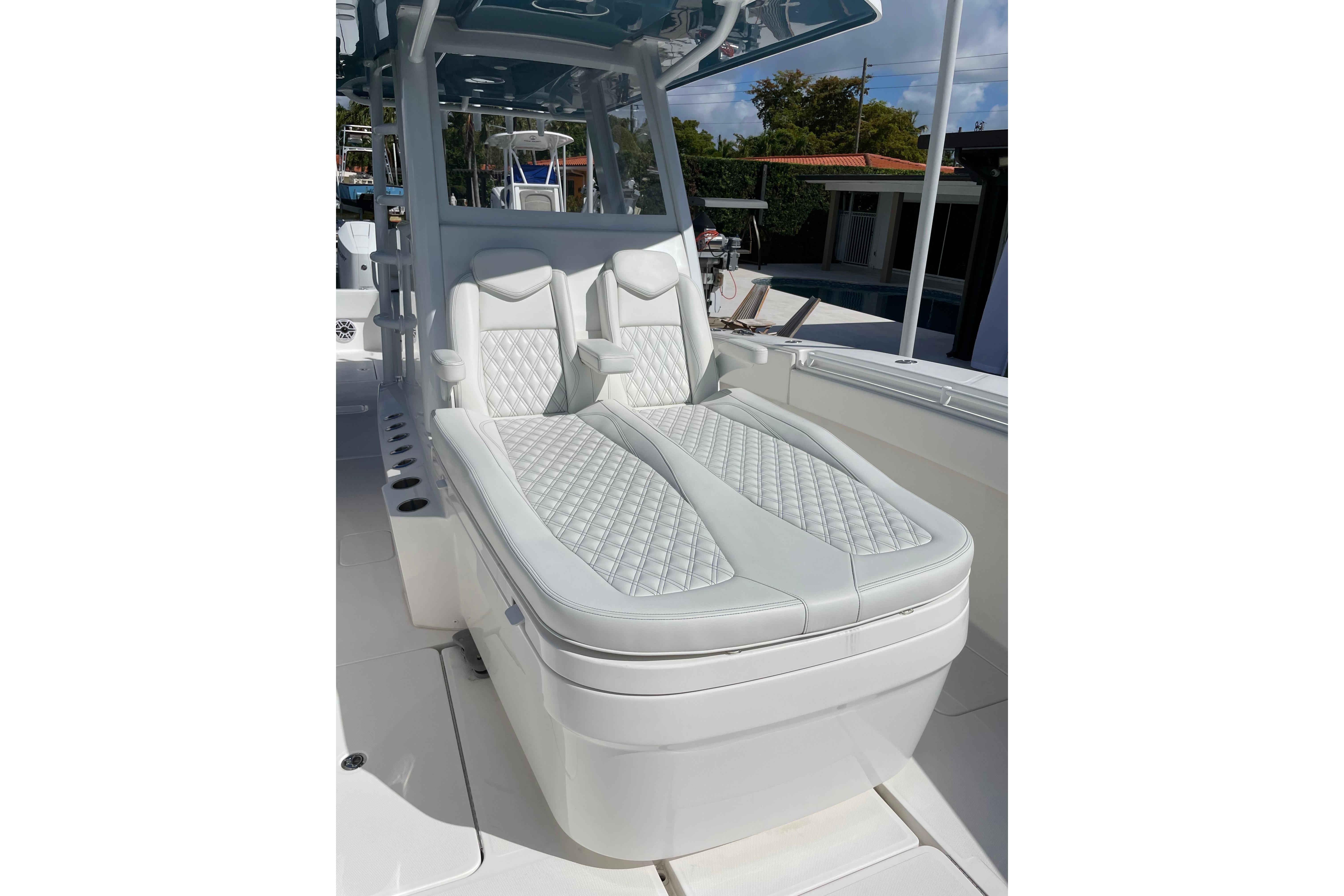 2024 Invincible 36 Open Fisherman boat with luxurious white seating and sleek design.