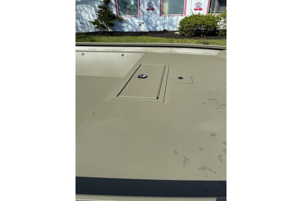 2026 Tracker Grizzly 1860 Utility boat deck with storage compartment.