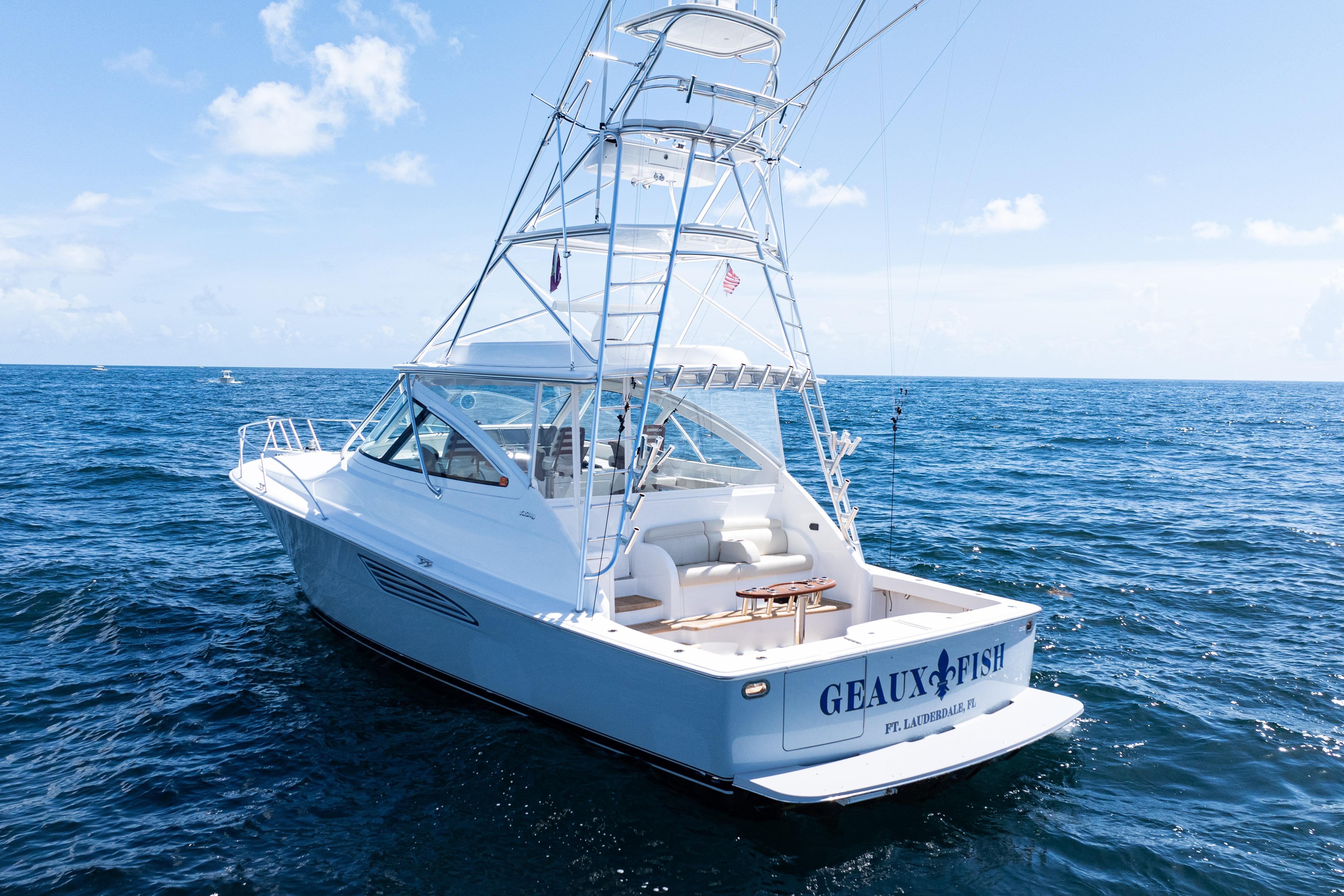 2021 Viking 44 Open yacht on open sea, featuring sleek design and fishing tower.