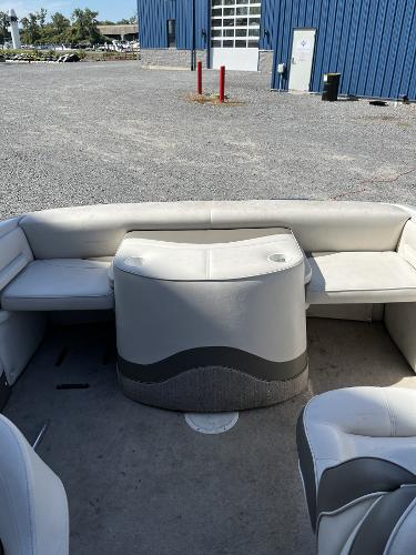 2005 Crownline 180 BR boat interior with white seating and storage compartment.