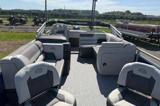 2026 Sun Tracker Fishin' Barge 20 DLX pontoon boat with spacious seating and modern design.