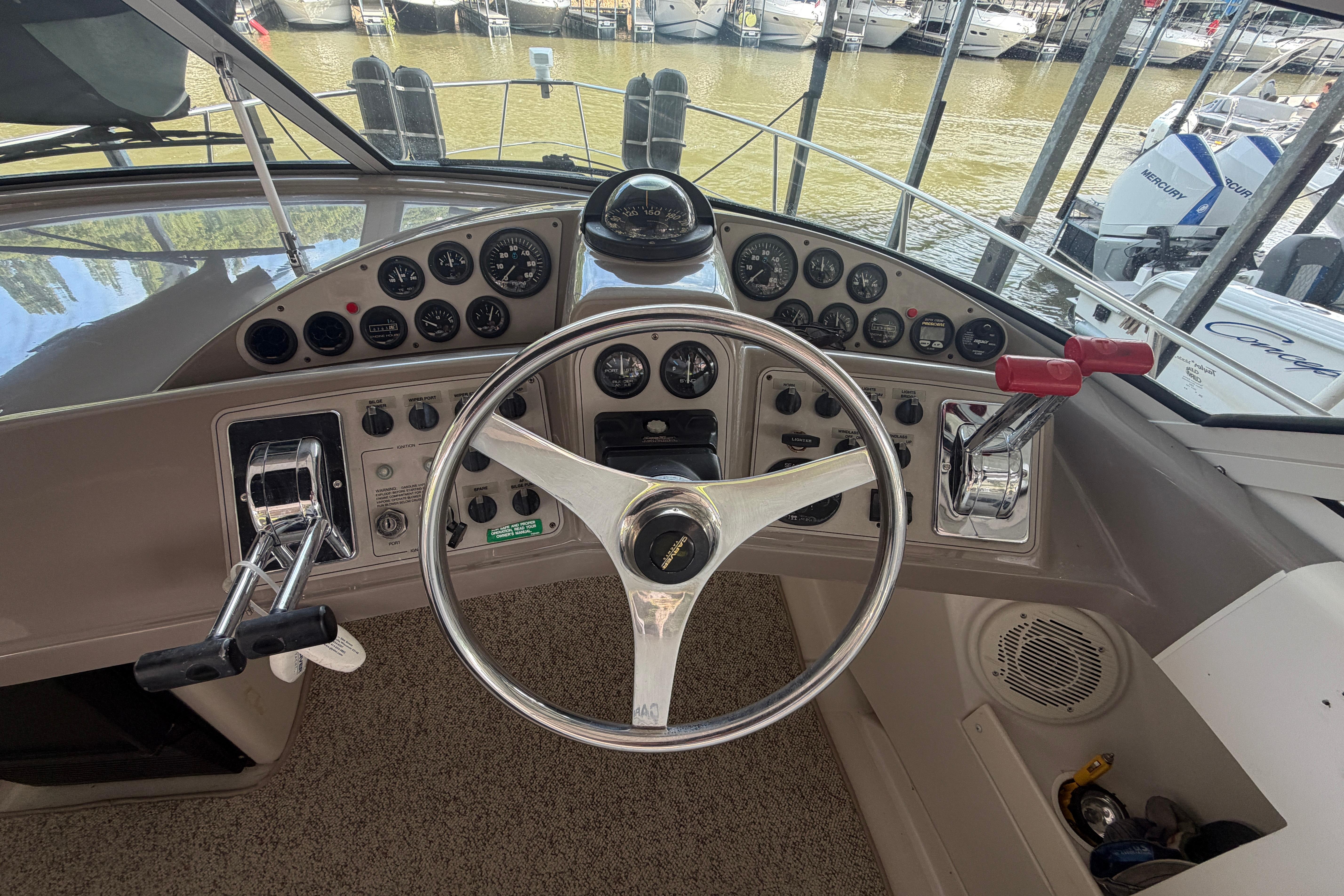 Helm of 2000 Carver 350 Mariner with steering wheel and control panel.