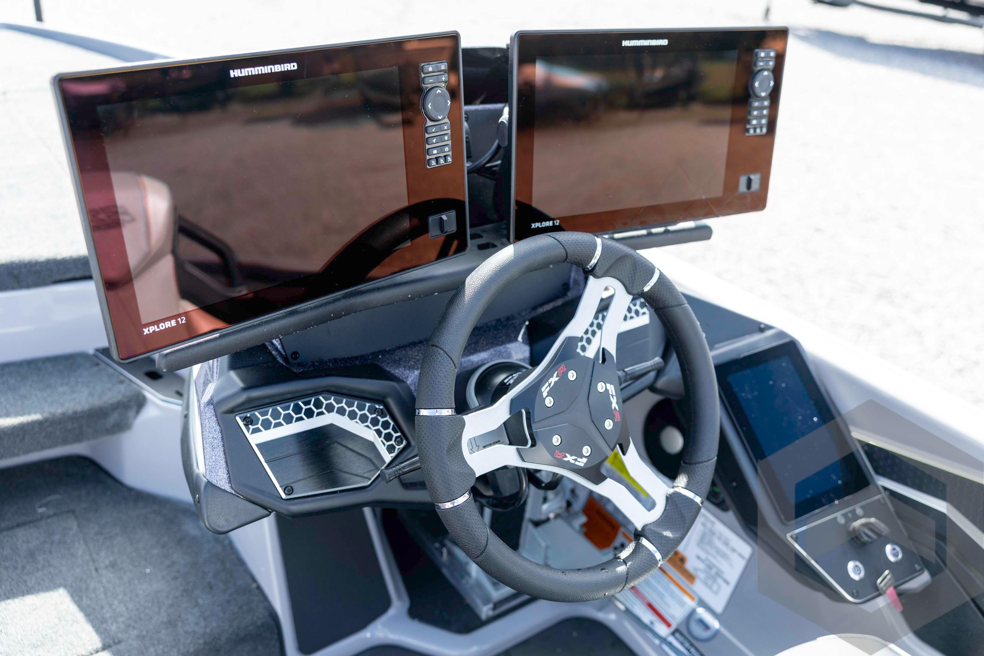 2026 Skeeter FXR20 FLEX boat dashboard with dual Humminbird Xplore 12 displays and modern steering wheel.
