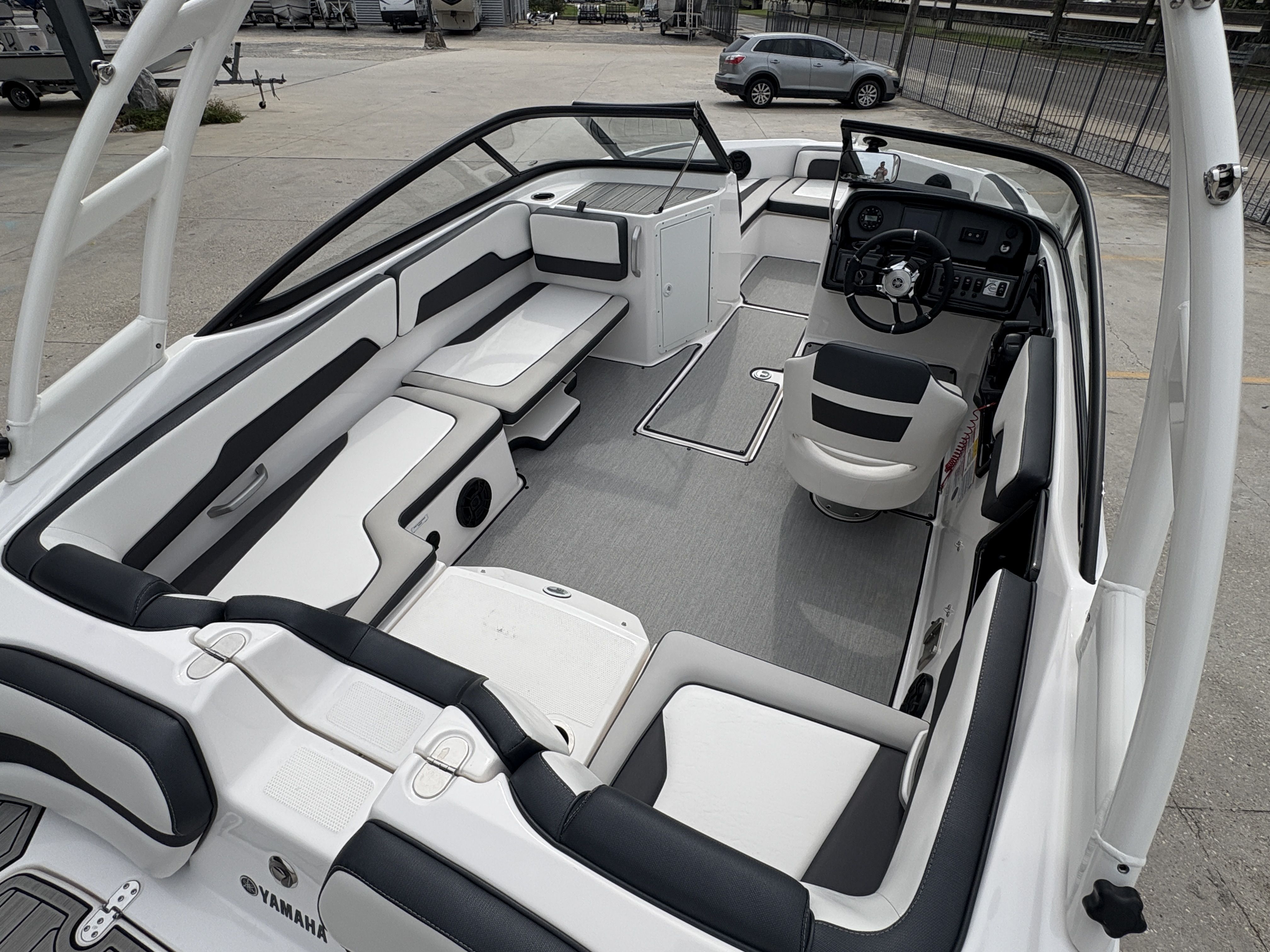 2024 Yamaha Boats AR 195 interior, featuring sleek seating and modern dashboard design.