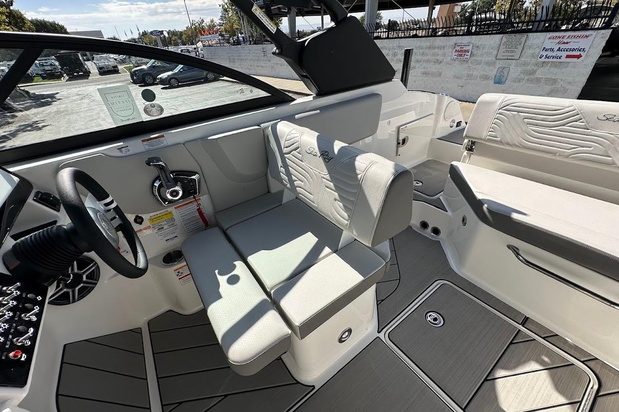 Interior of 2026 Sea Ray SDX 230 Surf boat, featuring sleek seating and modern controls.