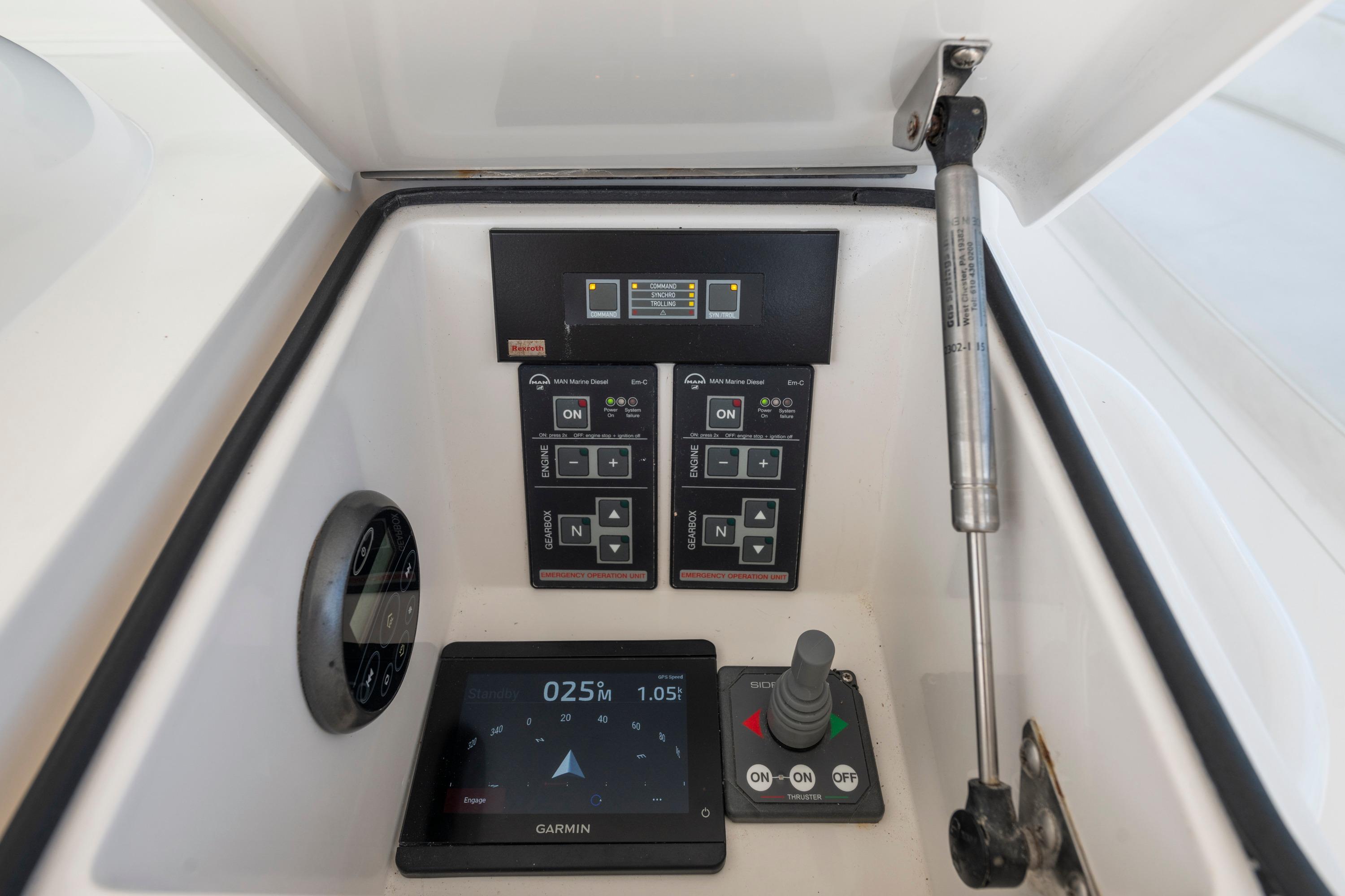 Control panel of a 2009 Viking 50 Convertible yacht with Garmin navigation display.