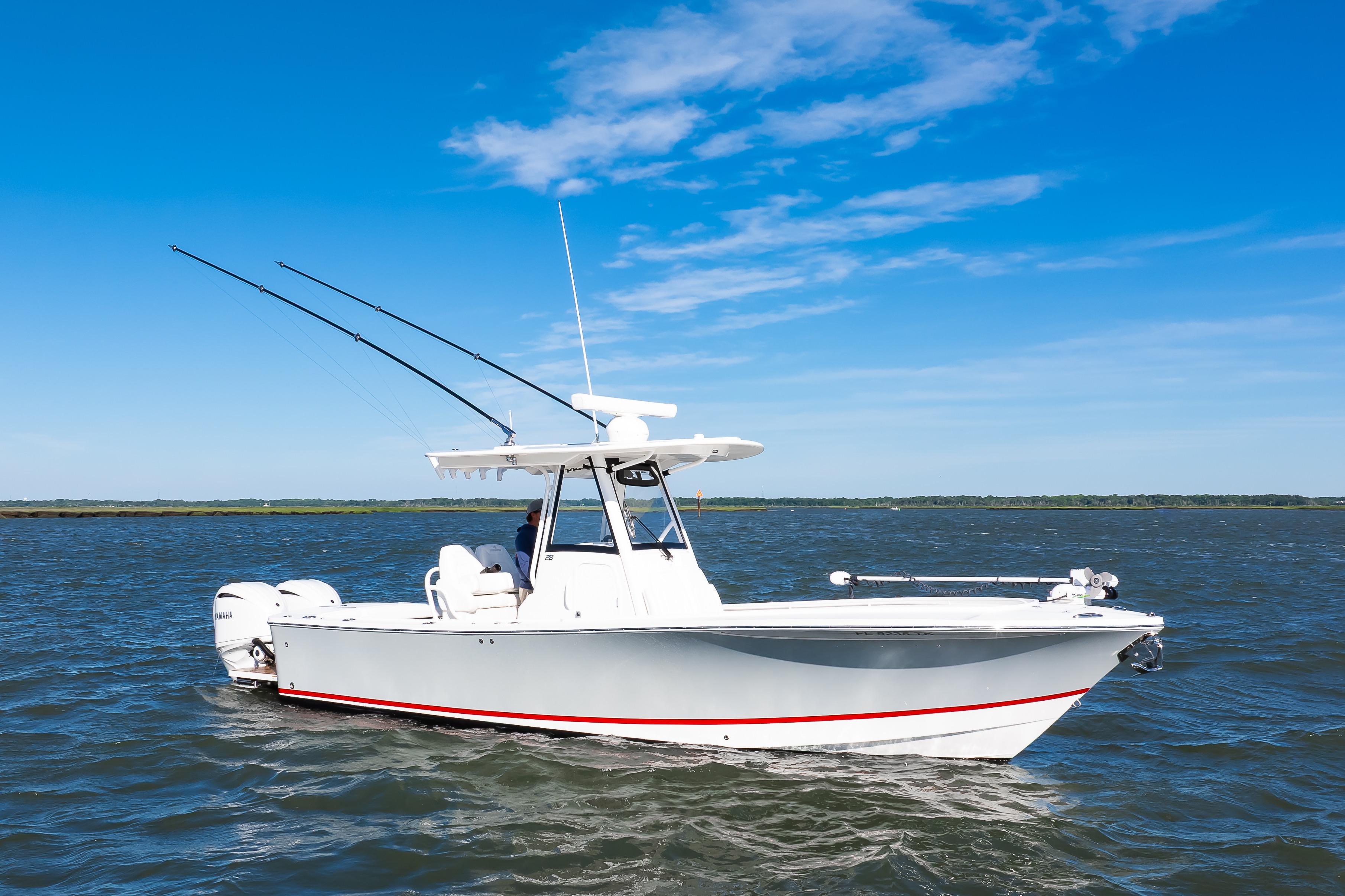 2022 Regulator 28 Forward Seating boat cruising on open water under clear blue sky.
