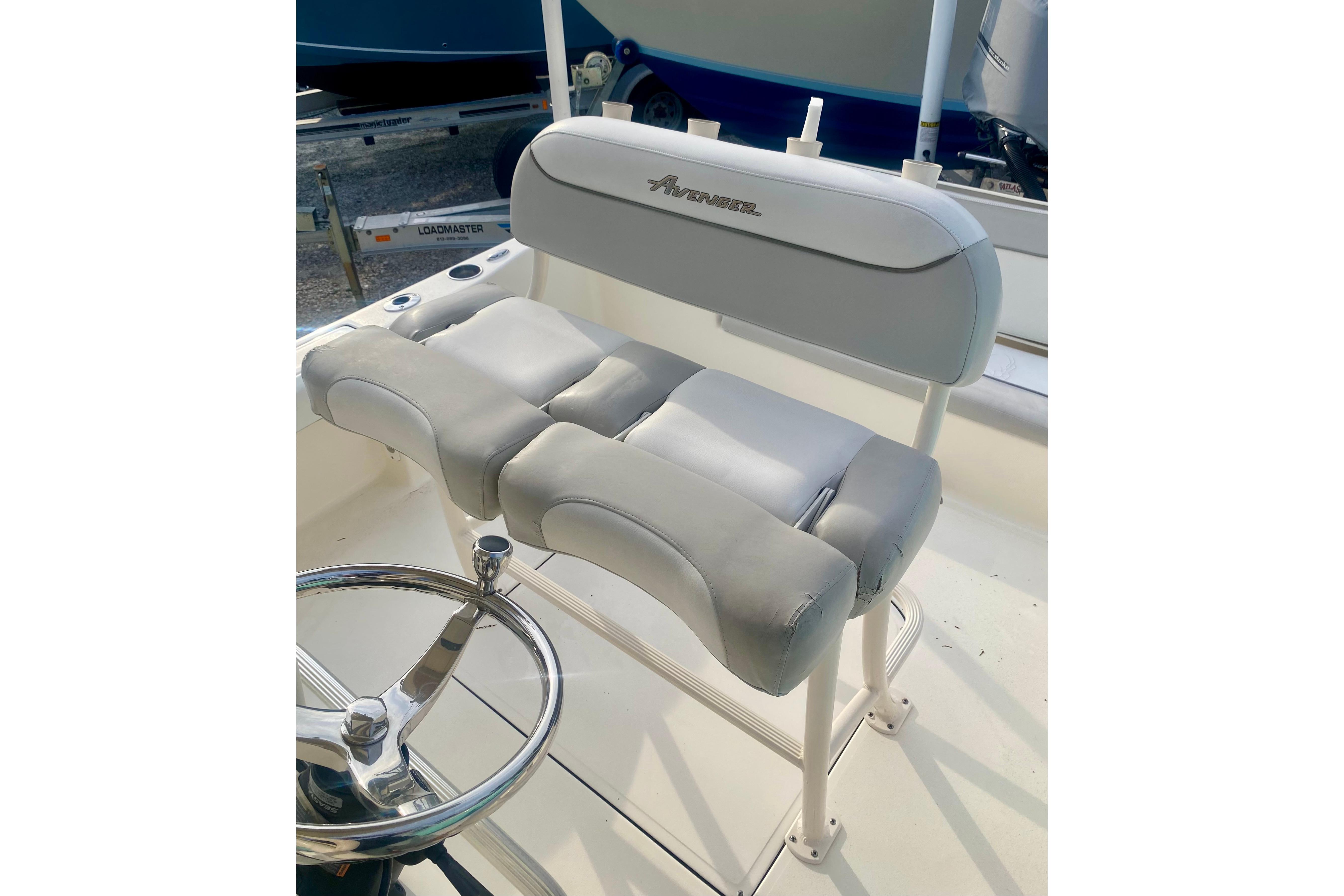 2018 Avenger AV24 boat seat with cushioned backrest and steering wheel.