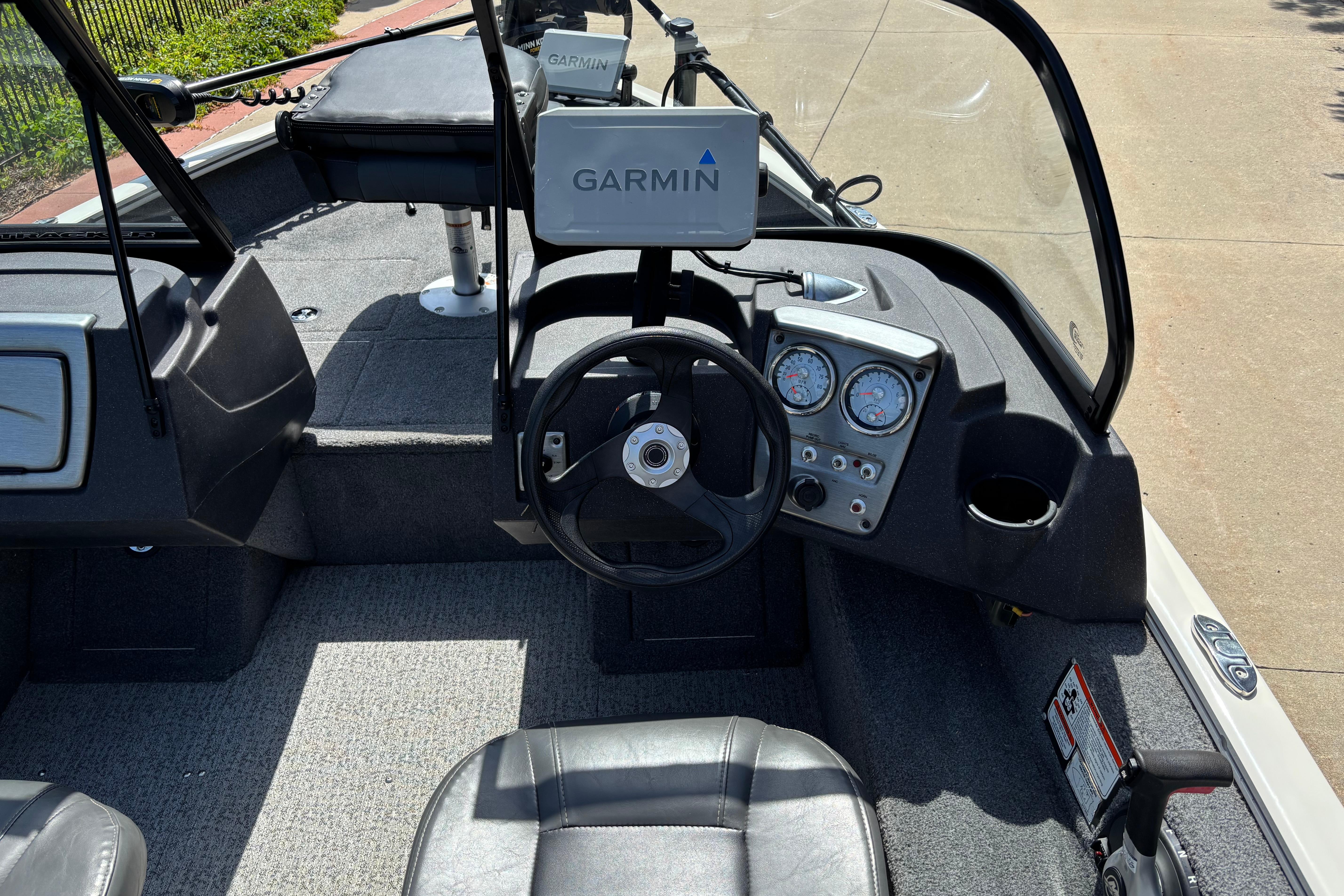 2022 Tracker Pro Guide V-16 SC boat interior with Garmin navigation system.