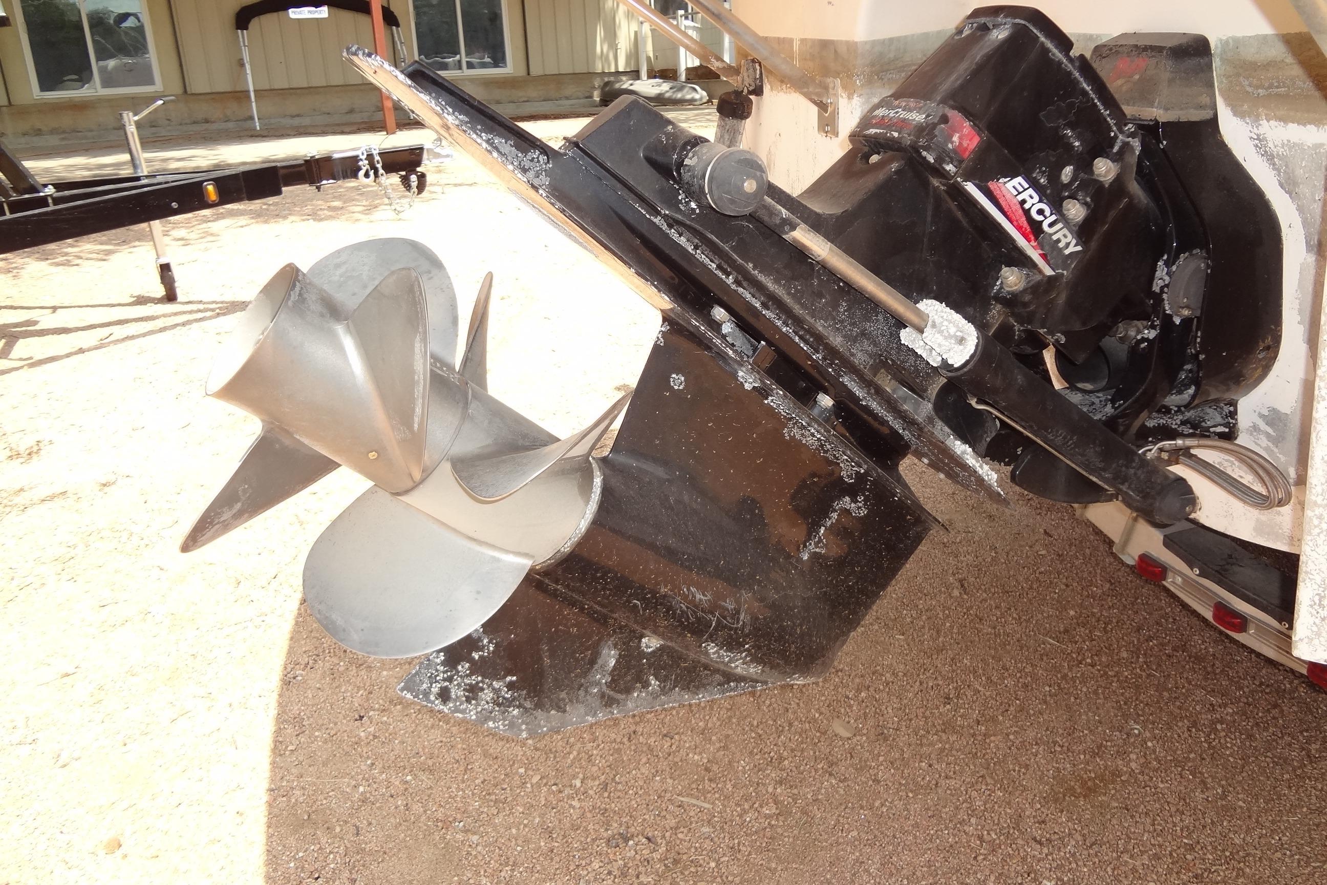 2000 Chaparral Signature 260 boat with Mercury outboard motor and propeller.