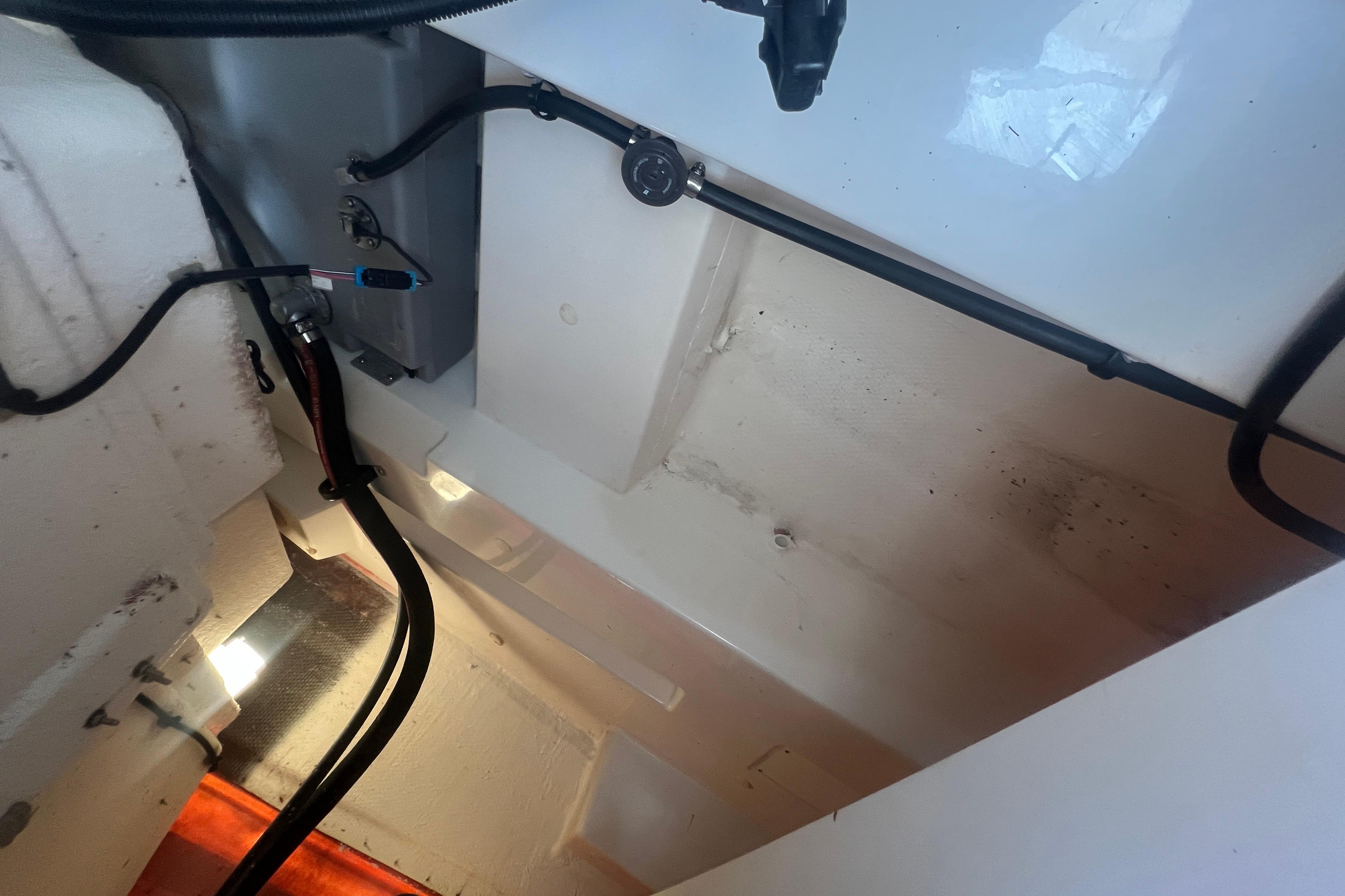 Interior view of a 2023 Tahoe T16 boat, showcasing wiring and components.