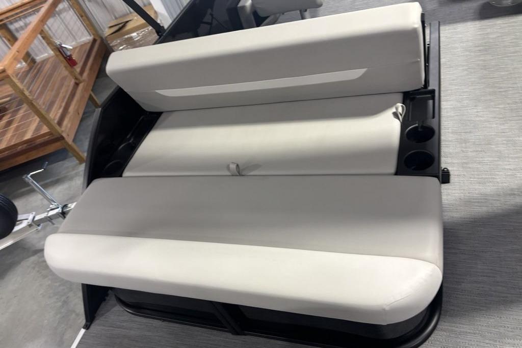 2026 Godfrey Xperience 2086 SFLX boat seating with cup holders, in showroom.