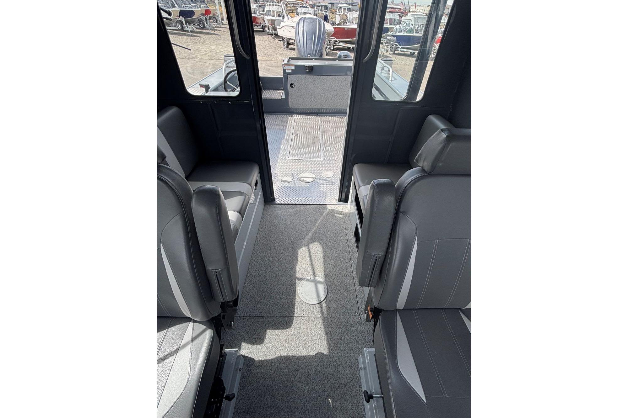 2024 Hewescraft 240 Ocean Pro Hardtop interior with gray seating and spacious layout.
