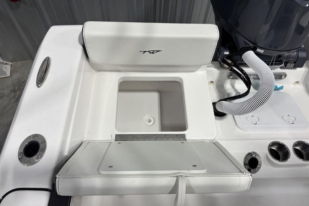 2026 Tidewater 198 CC Adventure boat interior with storage compartment and engine details.