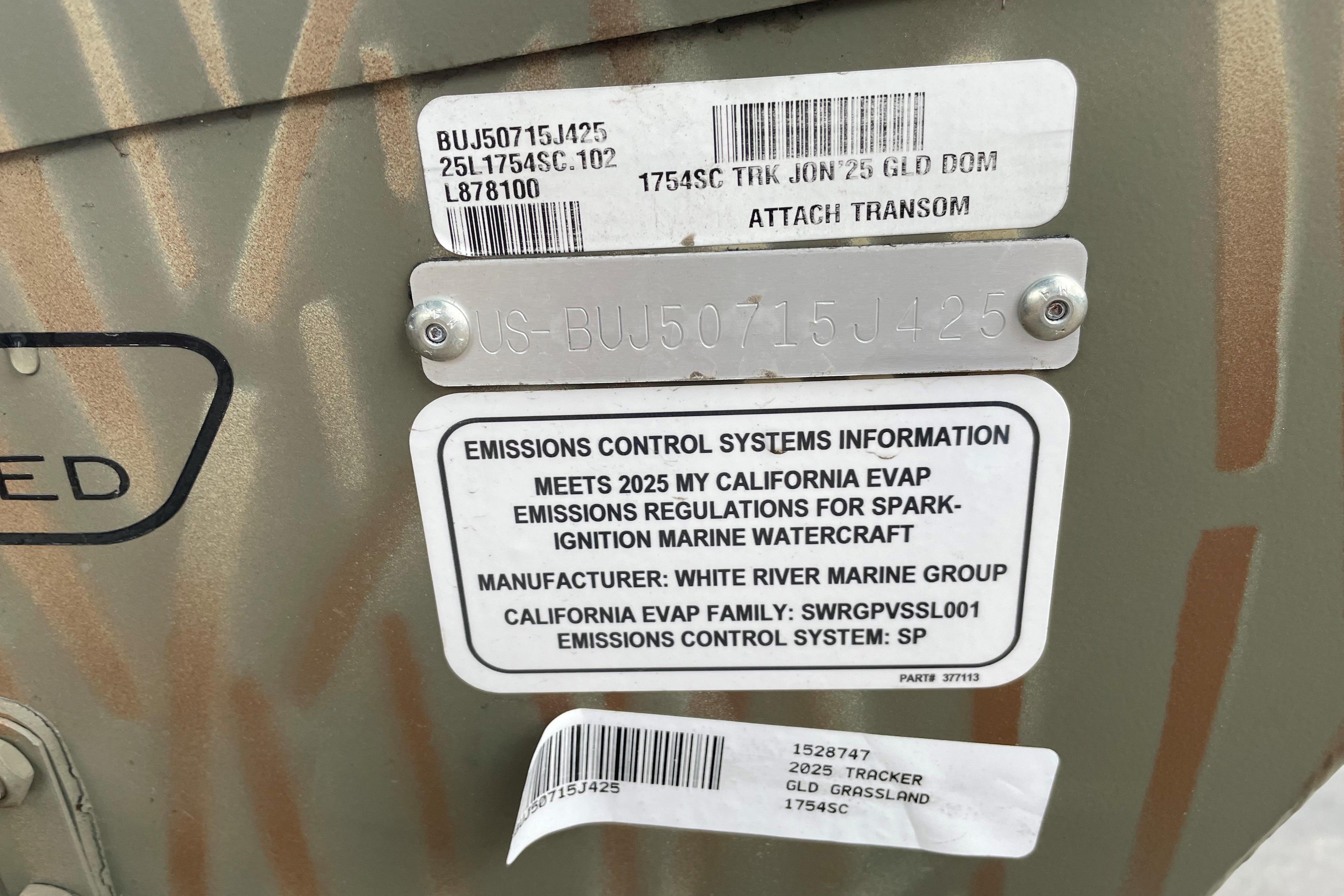 2025 Tracker Grizzly 1754 SC emissions control label on boat hull.
