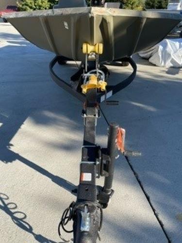 2024 Tracker Grizzly 1754 SC boat on trailer, parked outdoors.