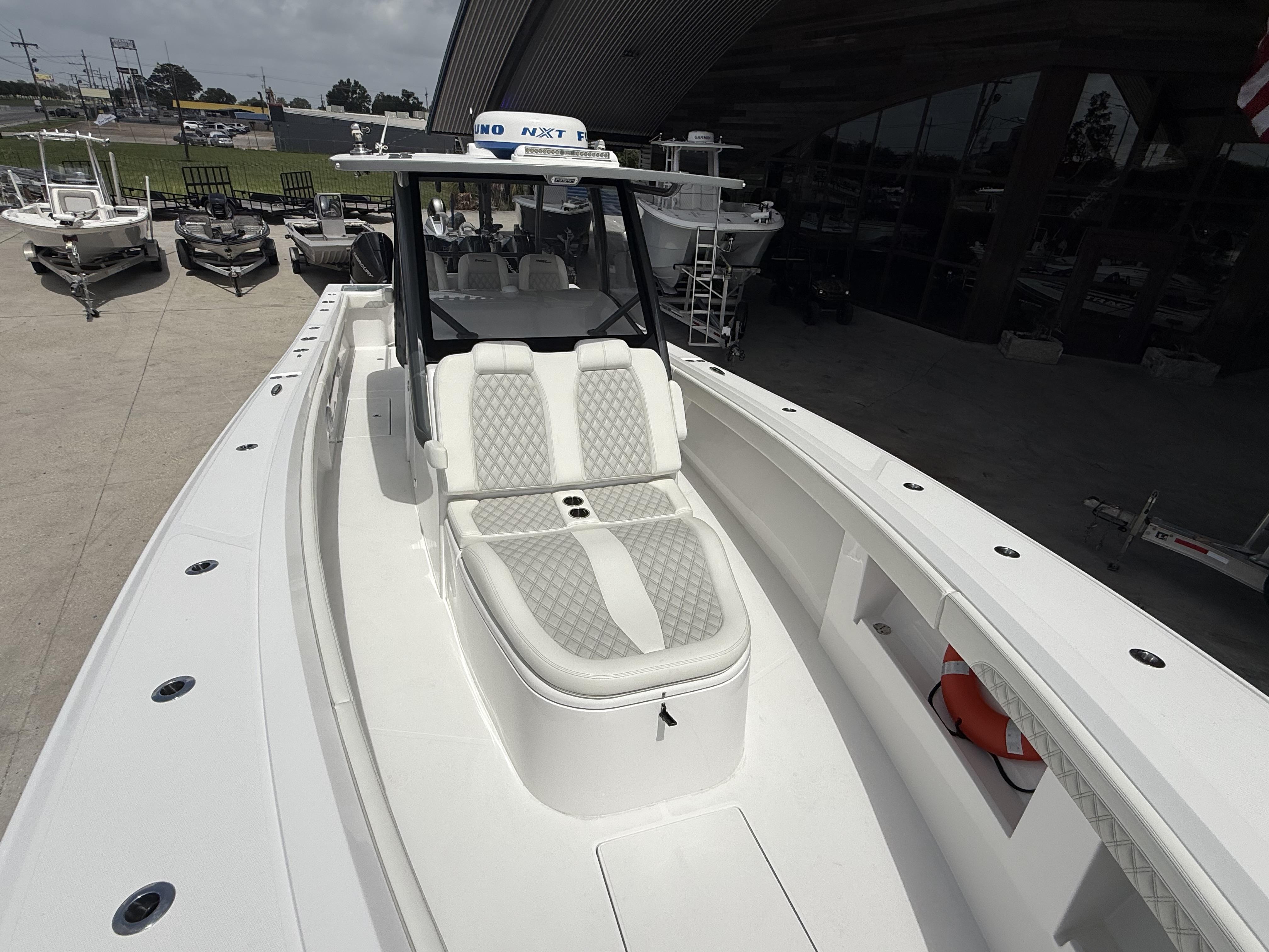 2024 Front Runner 39 CC boat with sleek white design and spacious seating.