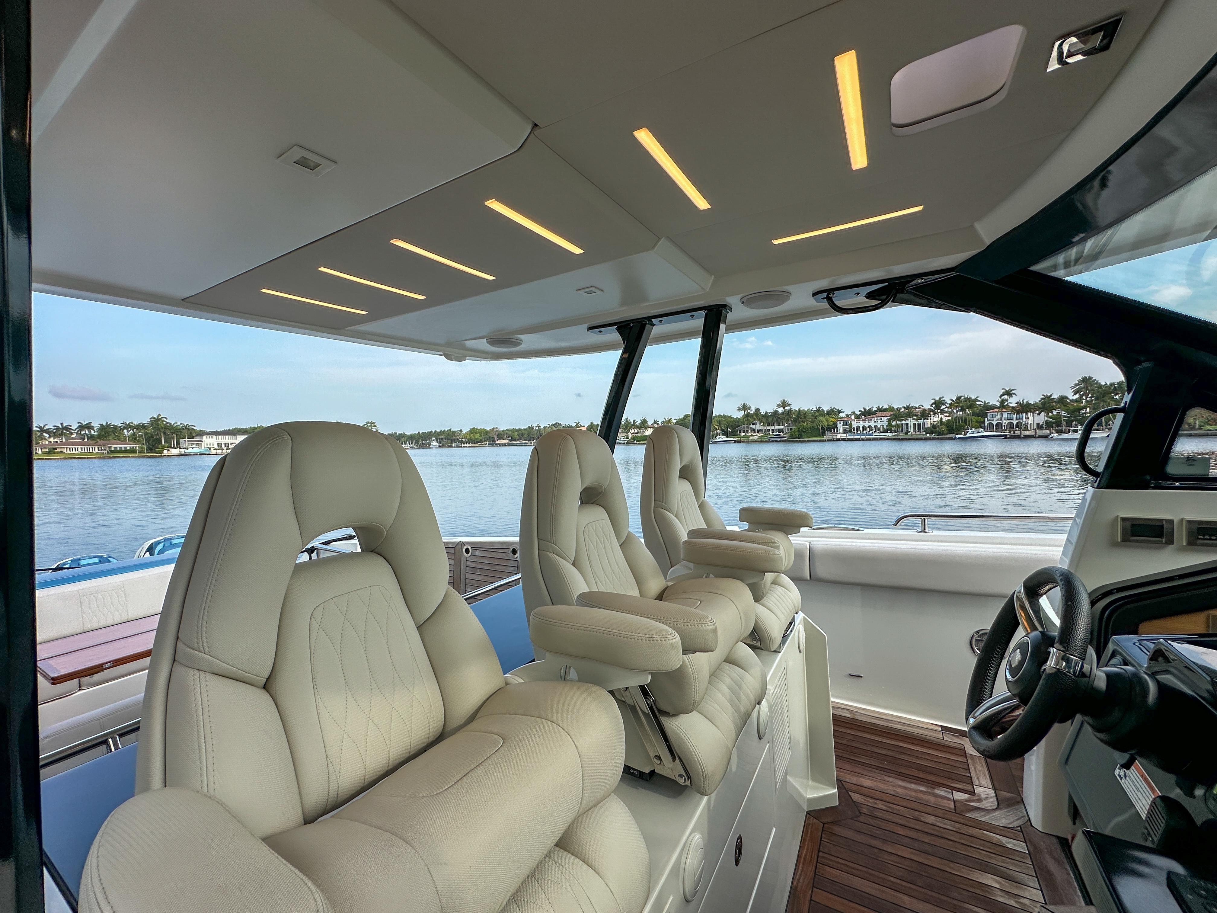 Interior of 2020 Ocean Alexander 45 Divergence Sport yacht with luxurious seating and scenic water view.