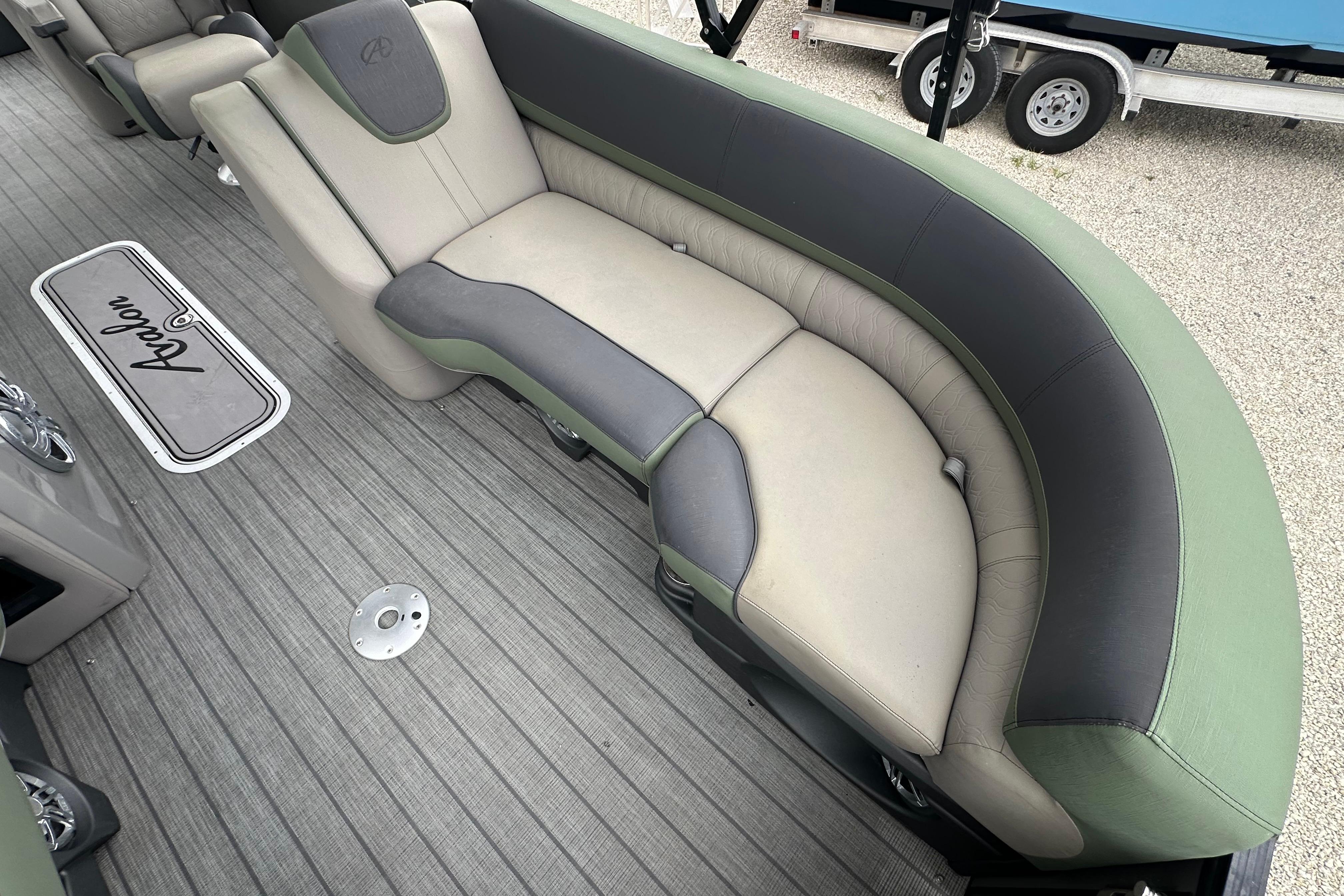 2023 Avalon Catalina Quad Lounge interior with stylish seating and branded flooring.