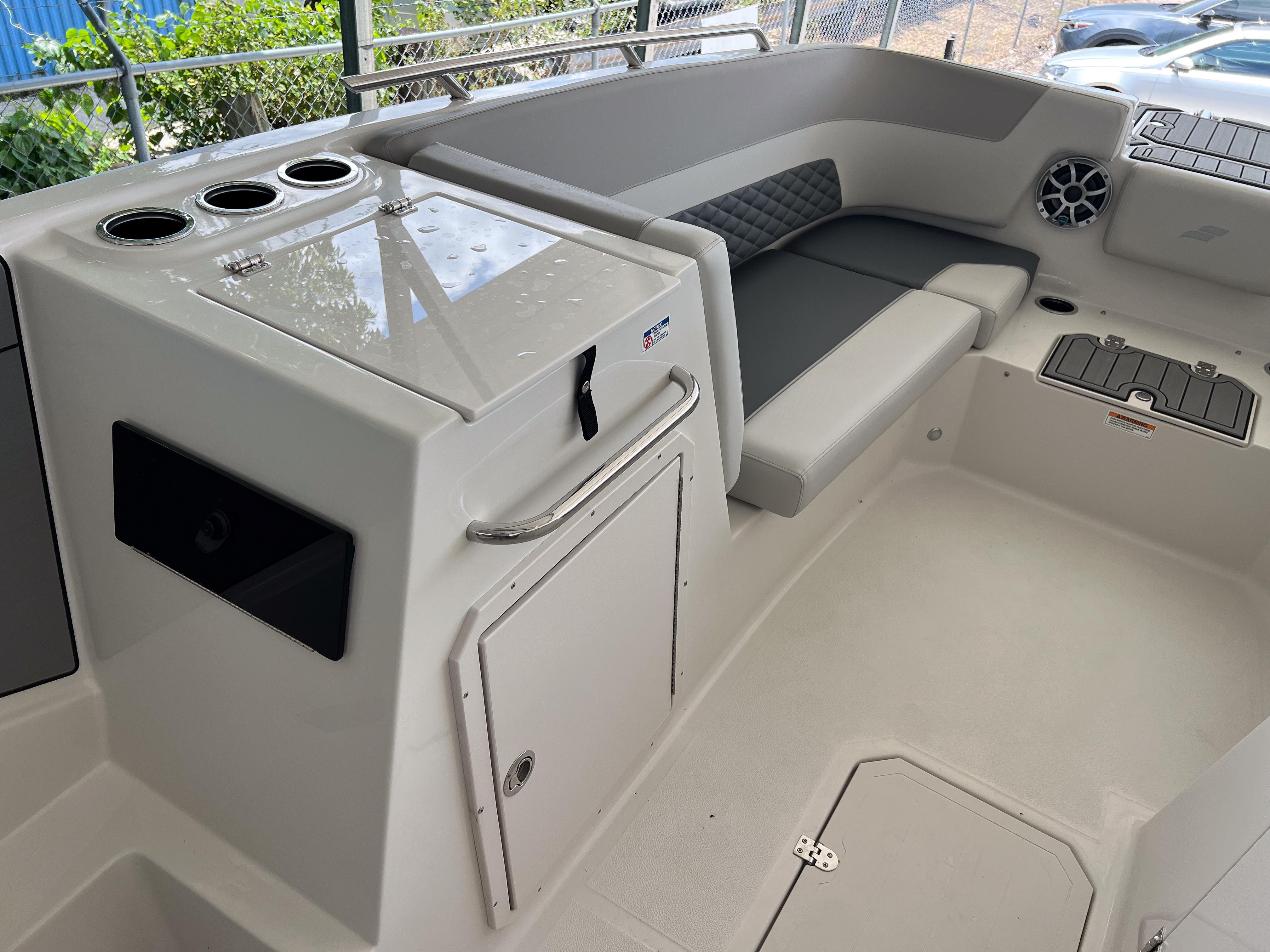 2026 Starcraft SVX 231 OB boat interior with seating and storage compartments.