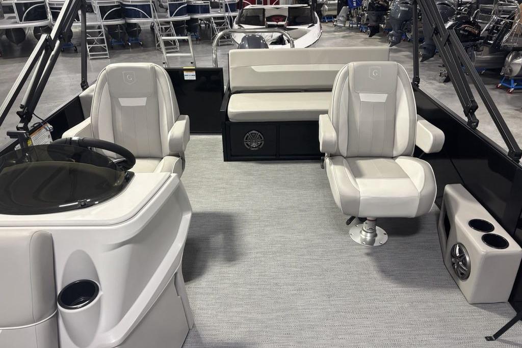 Interior of 2026 Godfrey Xperience 2086 SFLX boat, featuring plush seating and modern design.