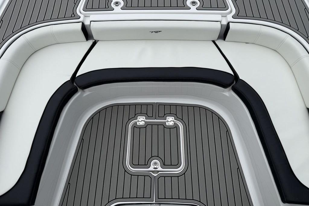2026 Tidewater 2500 Carolina Bay boat interior with cushioned seating and sleek flooring design.