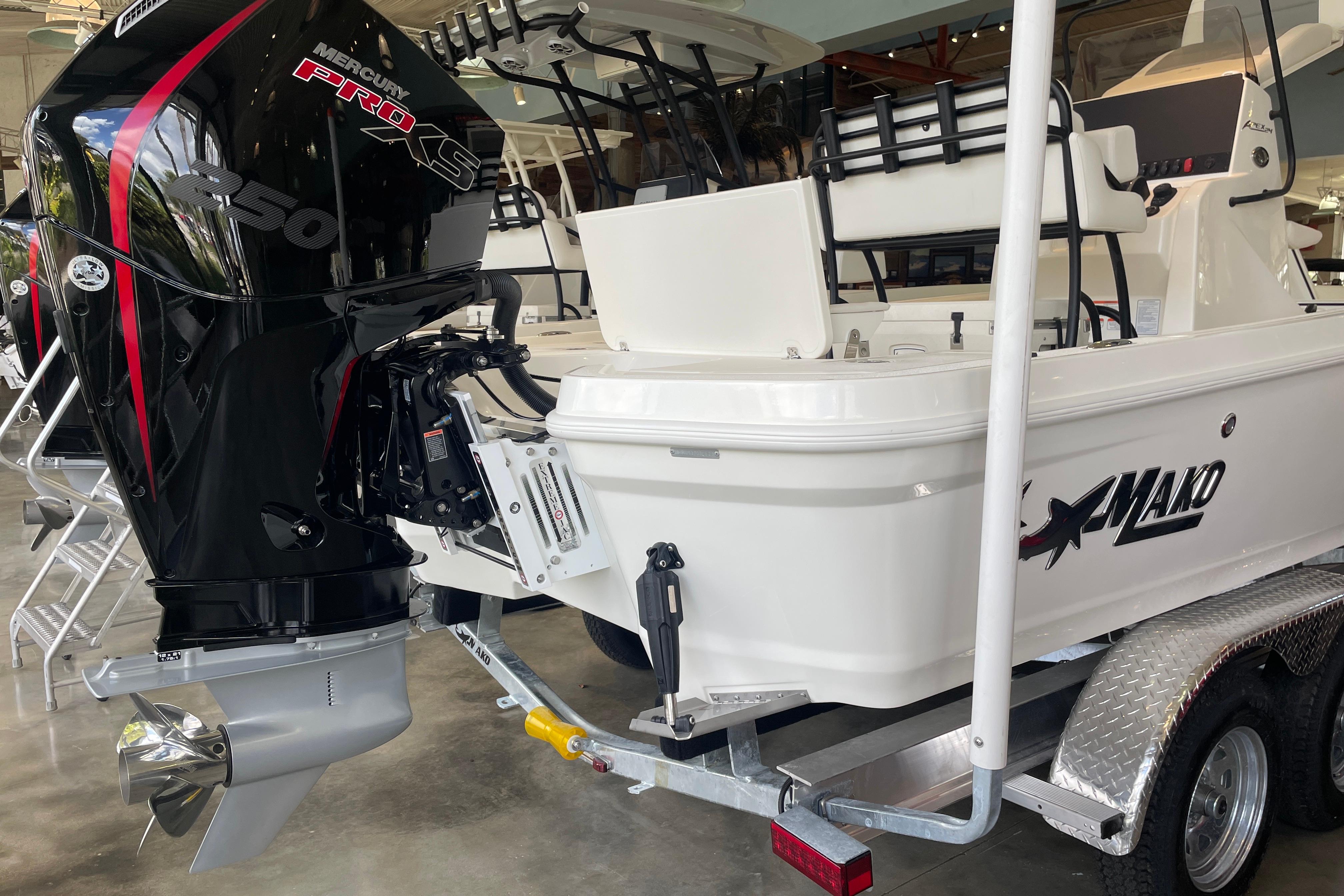 2026 Mako 24 APEX boat with Mercury Pro XS 250 engine on trailer.