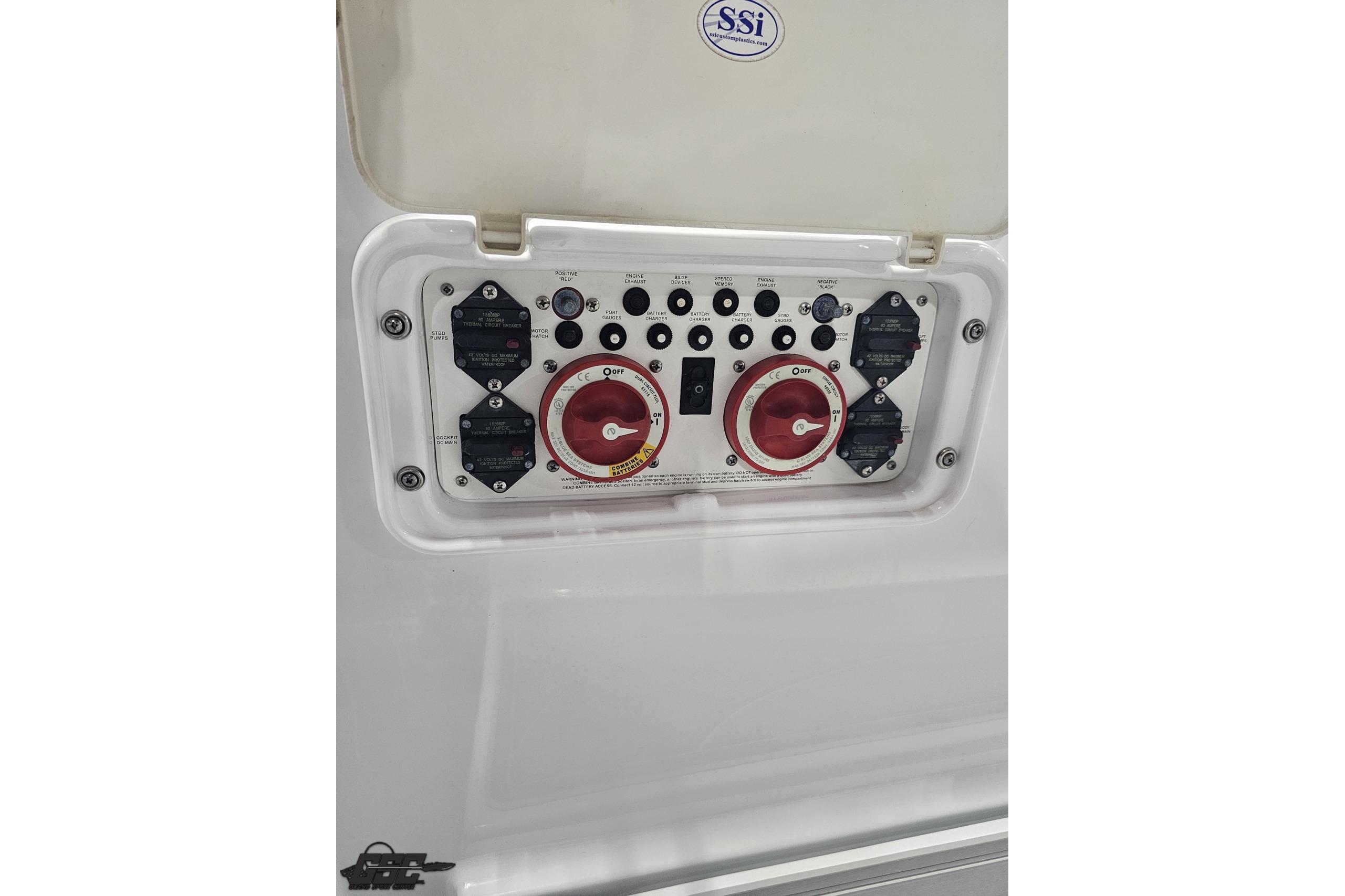 Control panel of a 2008 Baja 335 Performance boat with switches and dials.
