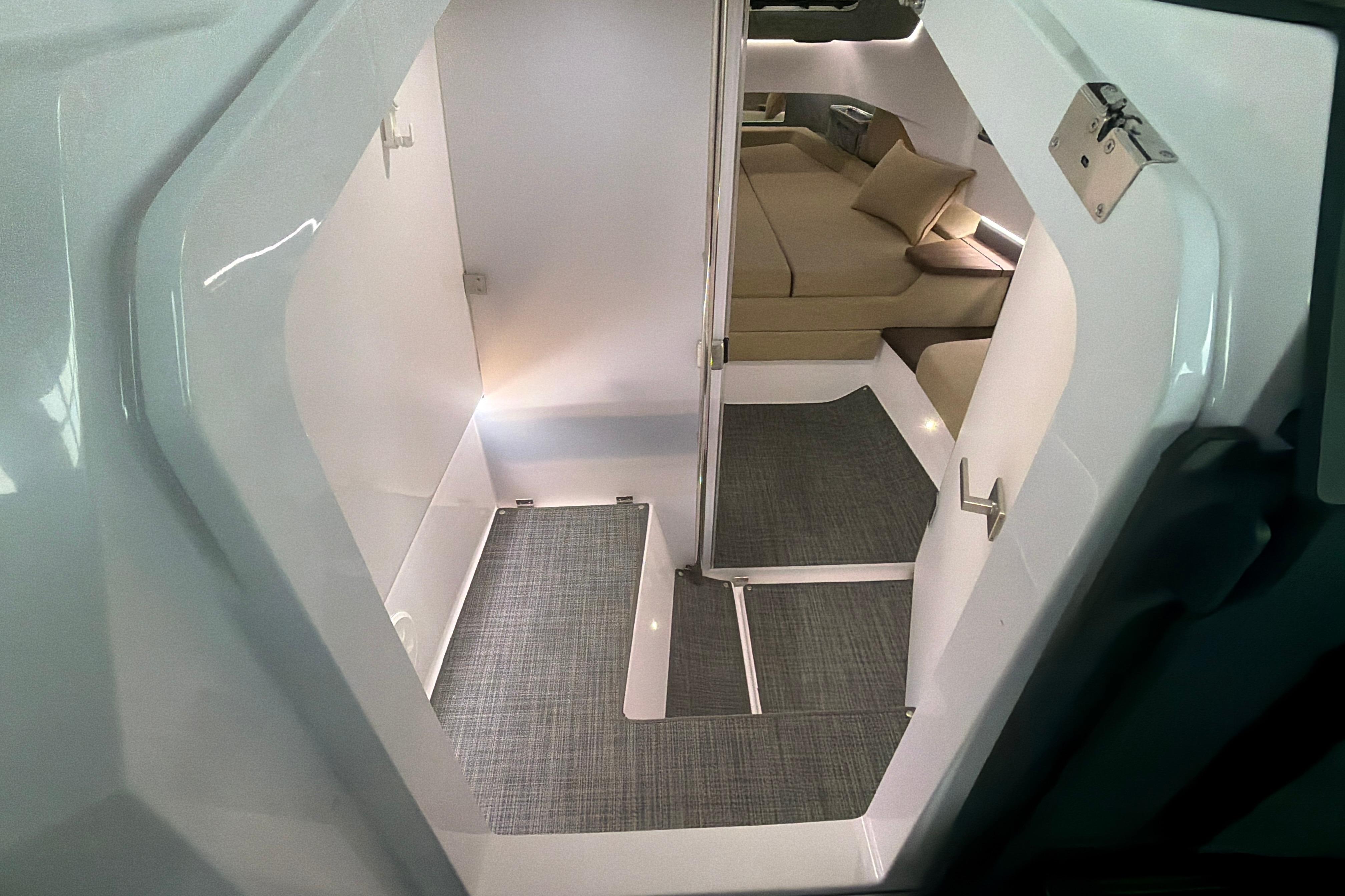Interior view of 2022 Axopar Brabus 37 XC Cross Cabin, featuring modern seating and sleek design.