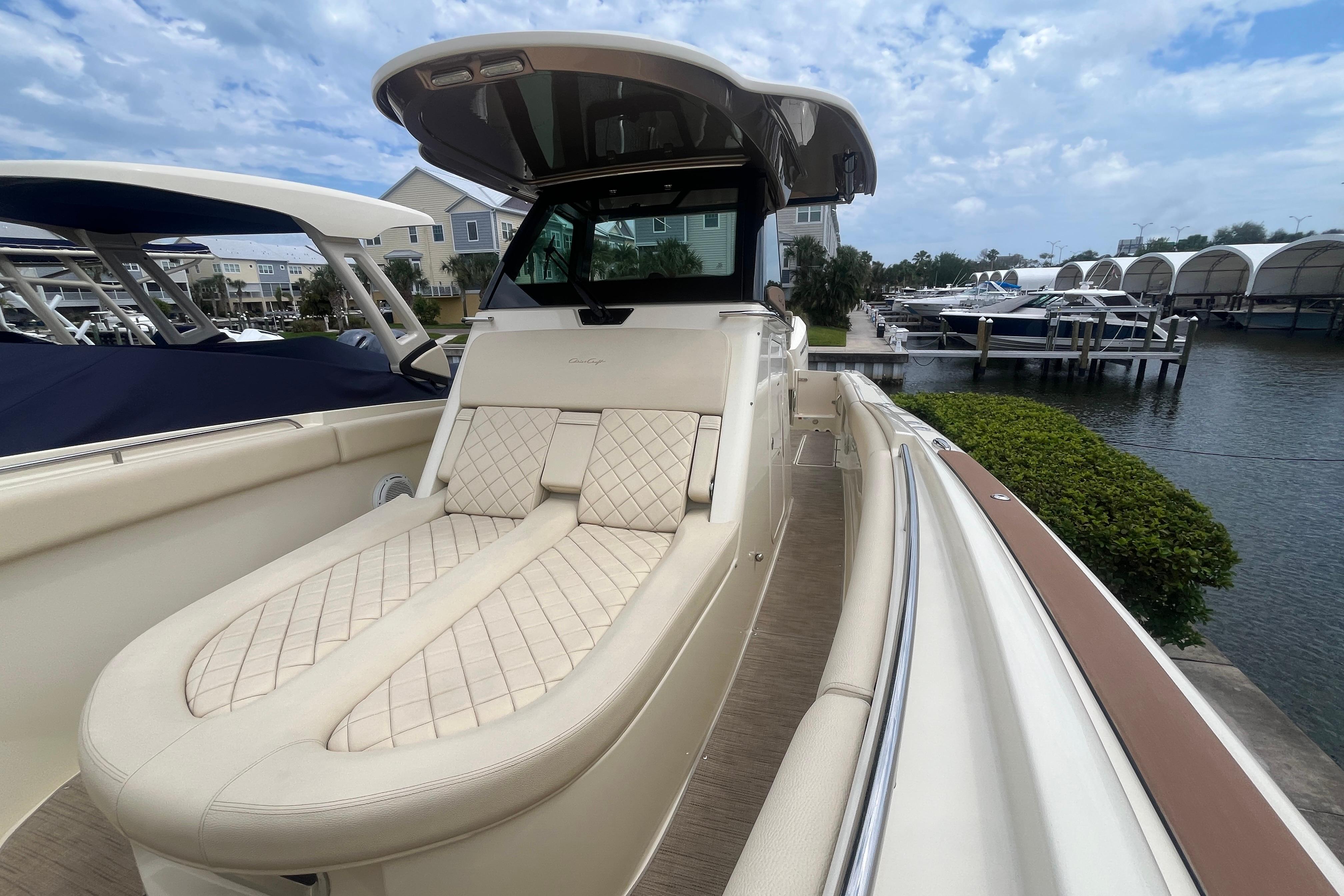 2024 Chris-Craft Catalina 30 luxury boat with elegant seating, docked at a marina.
