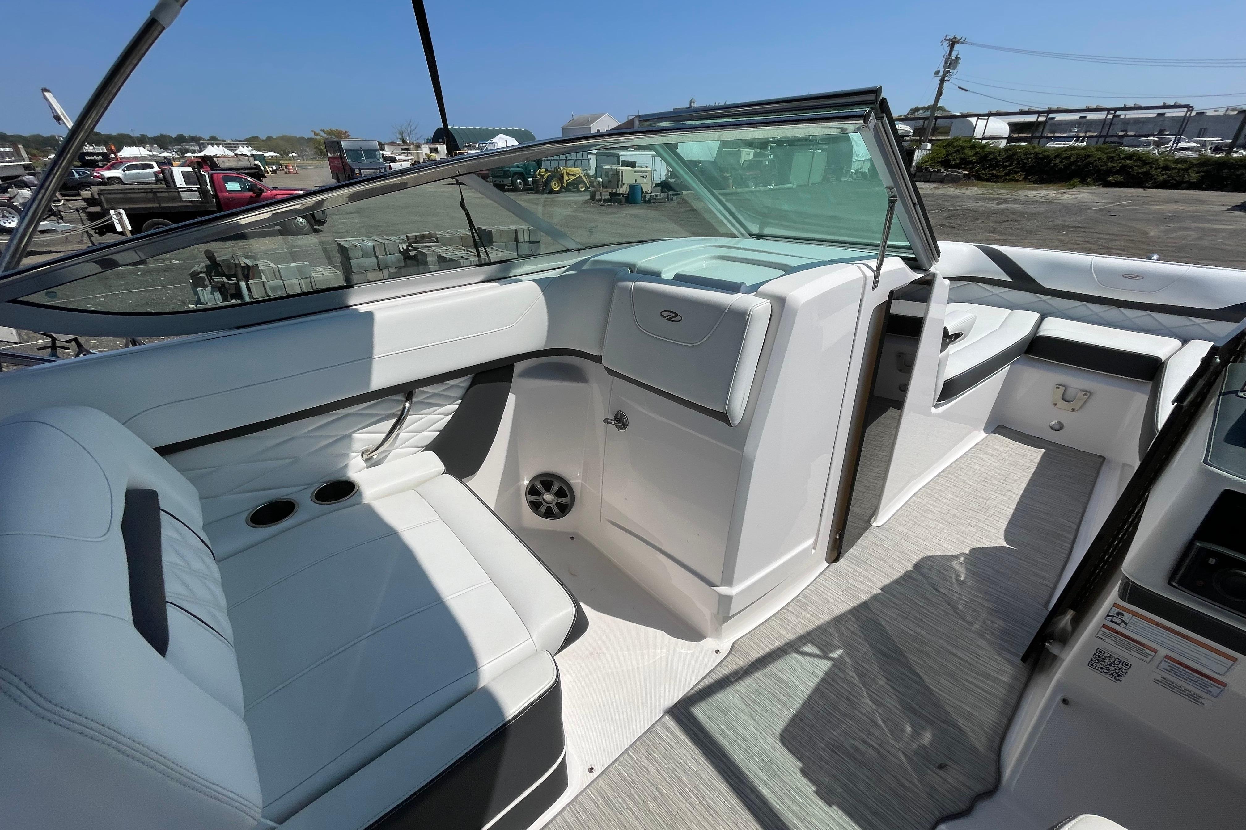 2018 Regal 26 OBX boat interior with white seating and modern dashboard.