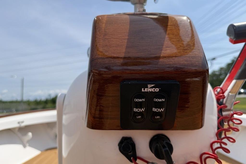 Control panel on a 2012 Chaos 16 Bonefish boat with Lenco trim tab switches.