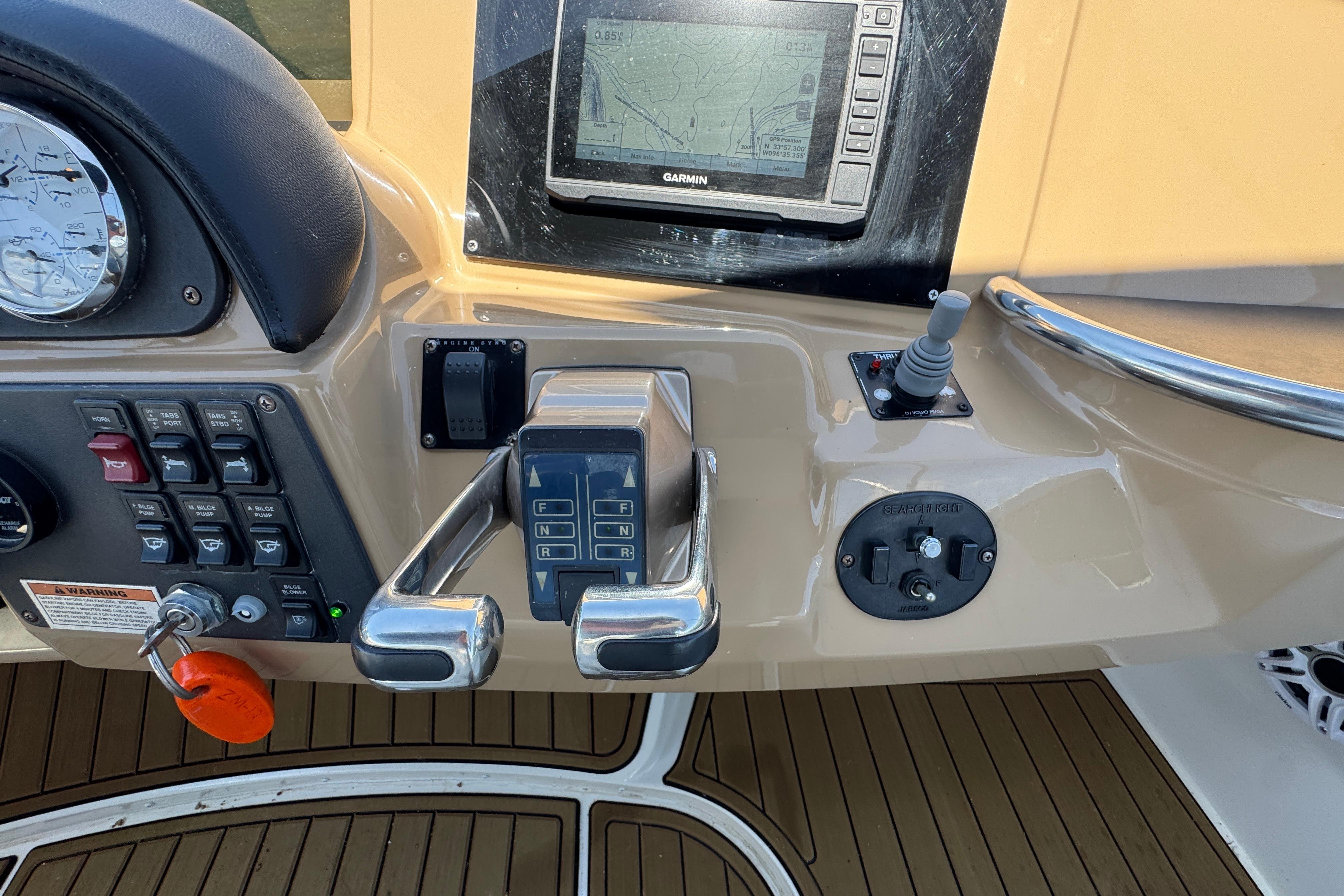Control panel of a 2002 Carver 396 Motor Yacht with navigation and throttle controls.