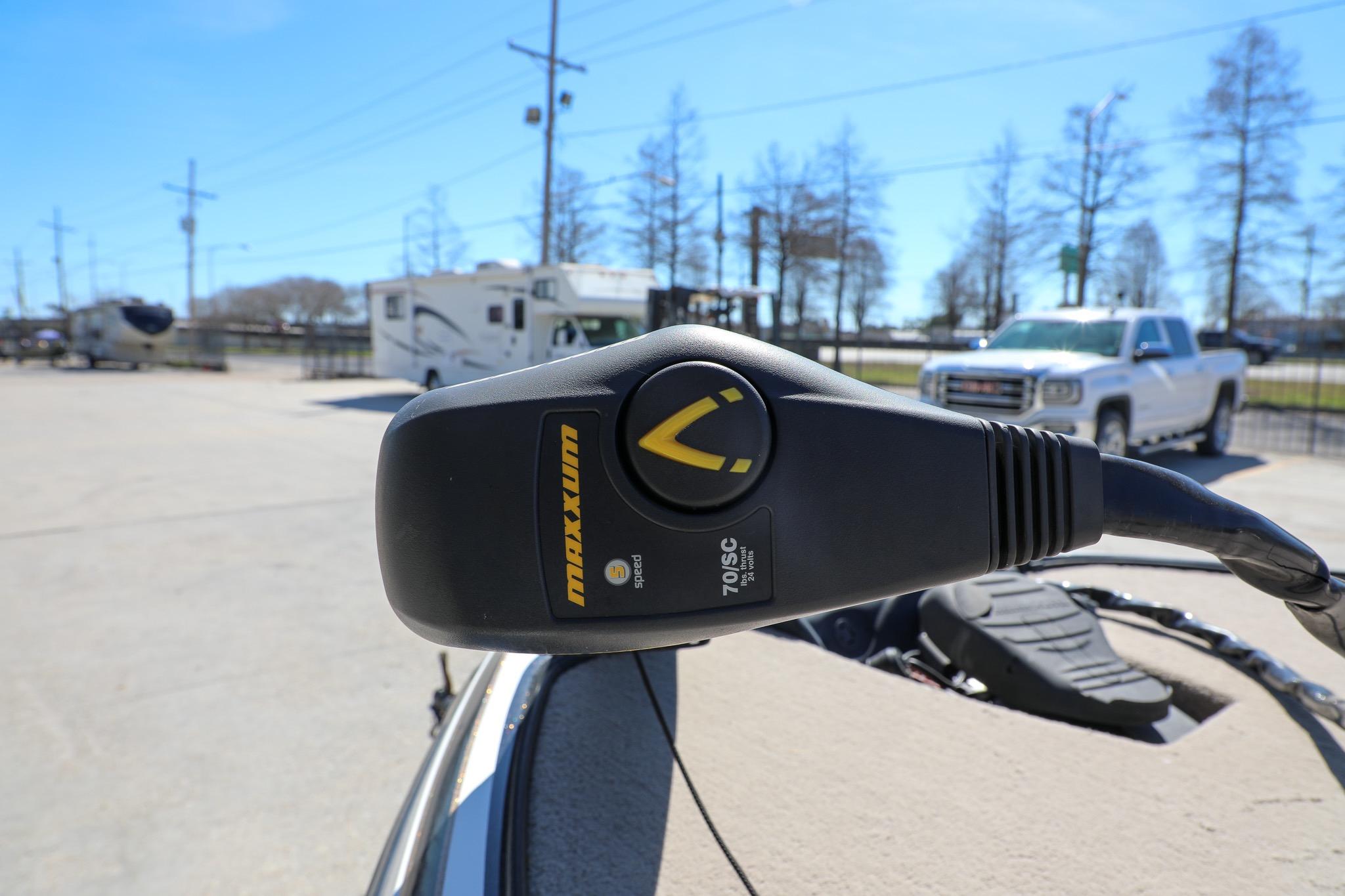Trolling motor control on a 2013 Nitro Z-7 boat, parked with RVs and trucks nearby.