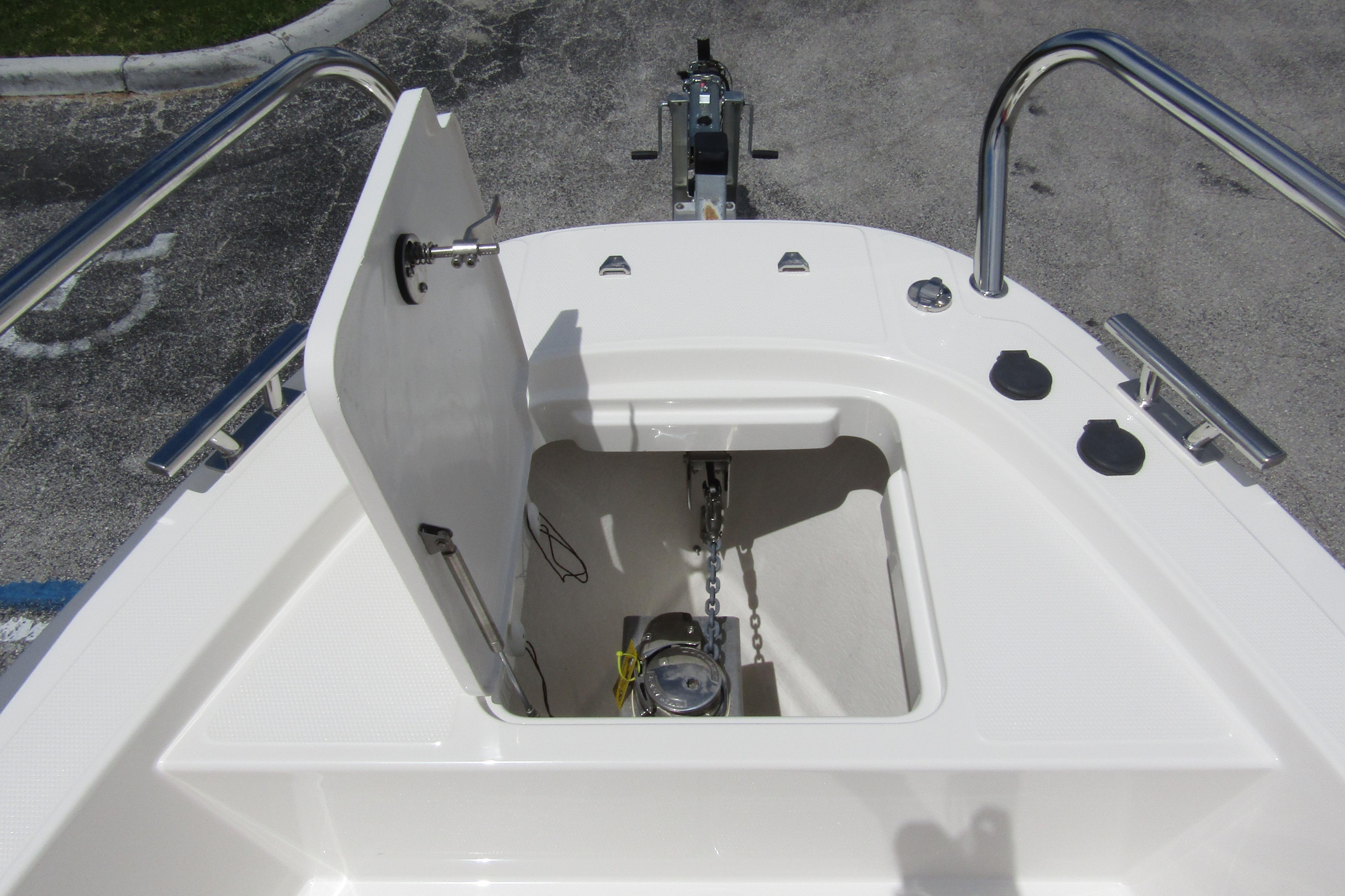 2024 Nimbus T8 boat anchor compartment with open hatch and visible chain mechanism.
